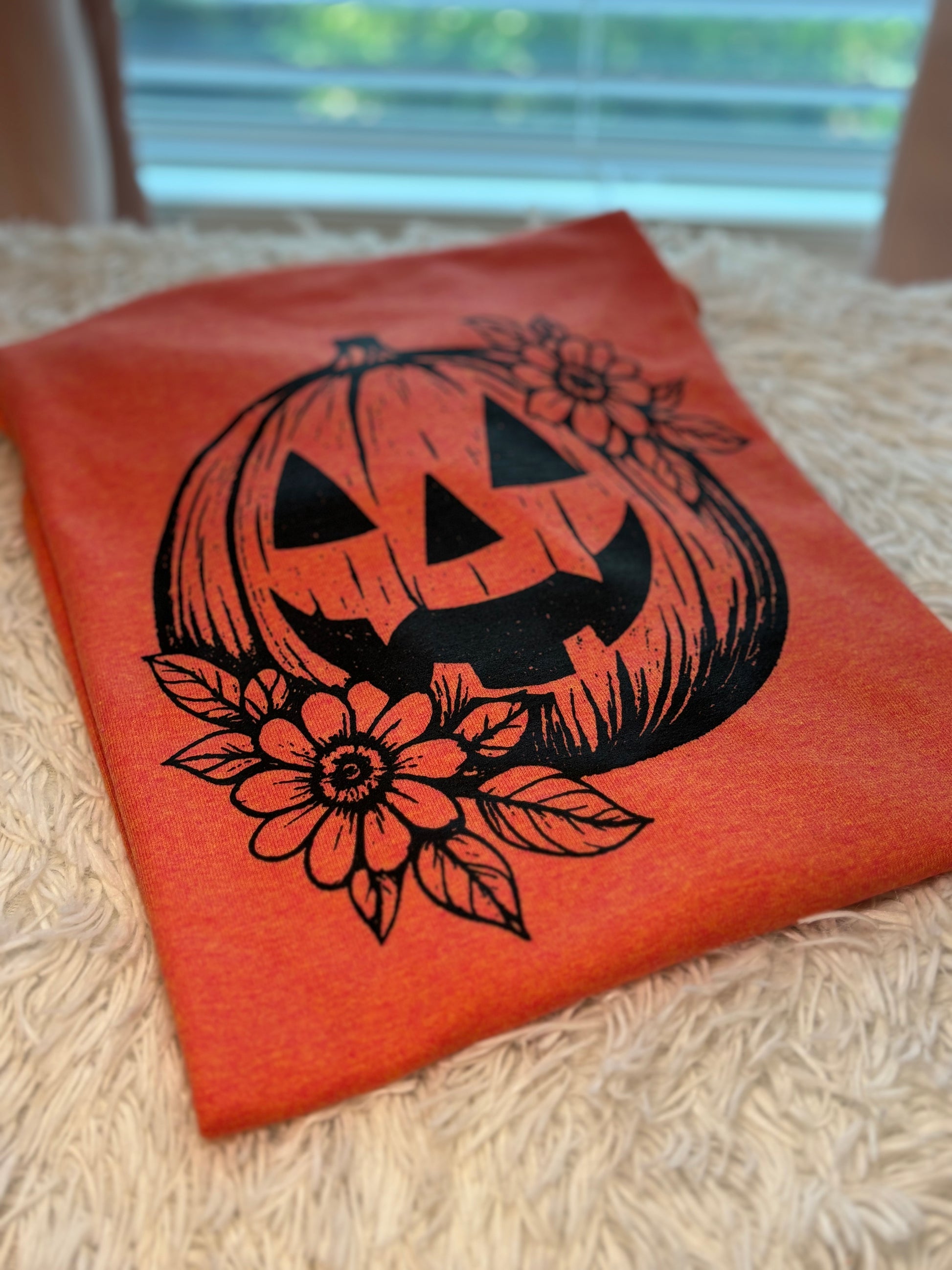 Orange heat press t-shirt with pumpkin and flower graphic