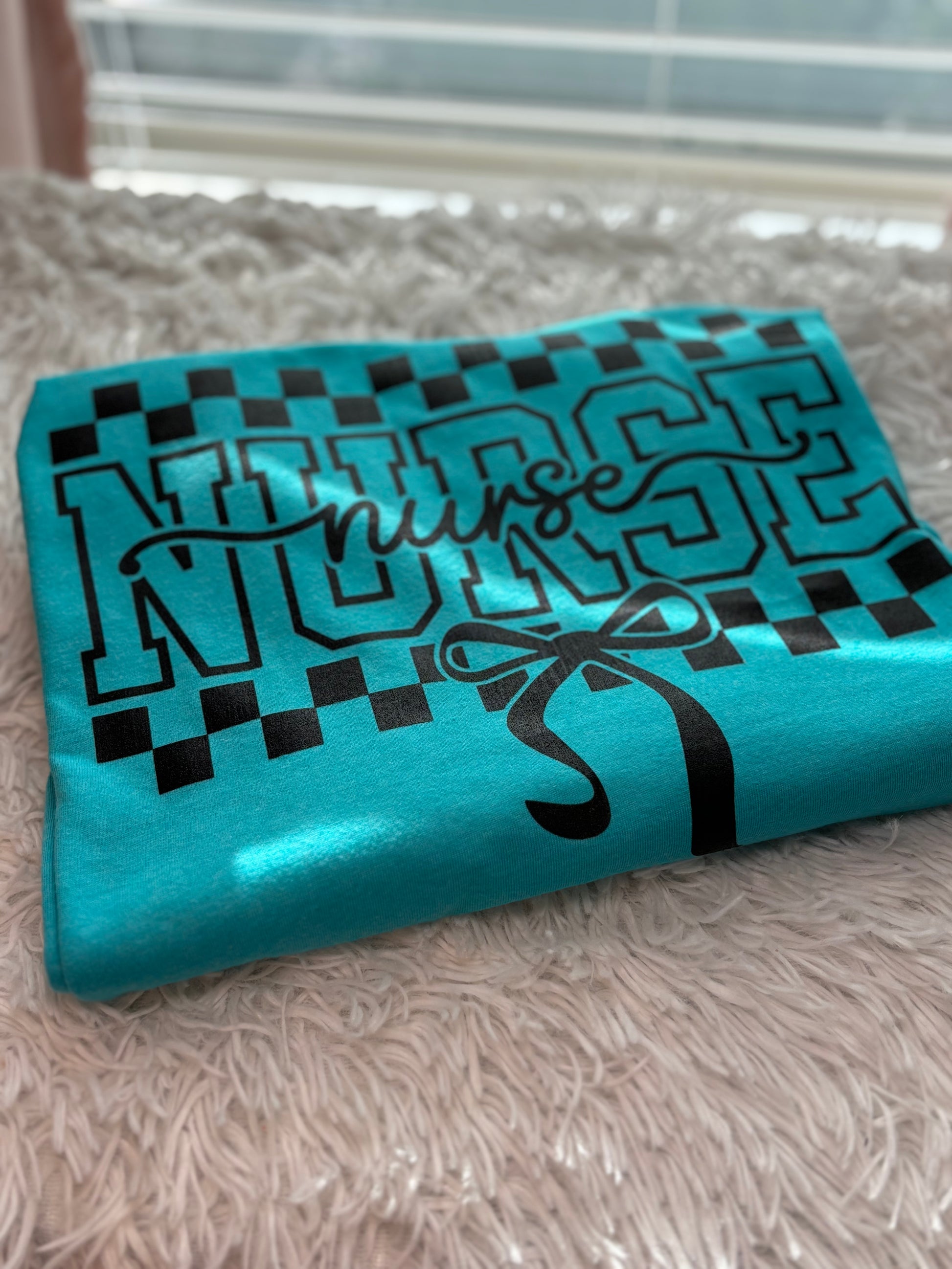 Teal heat press t-shirt with 'Nurse' text - checkered and bow outline