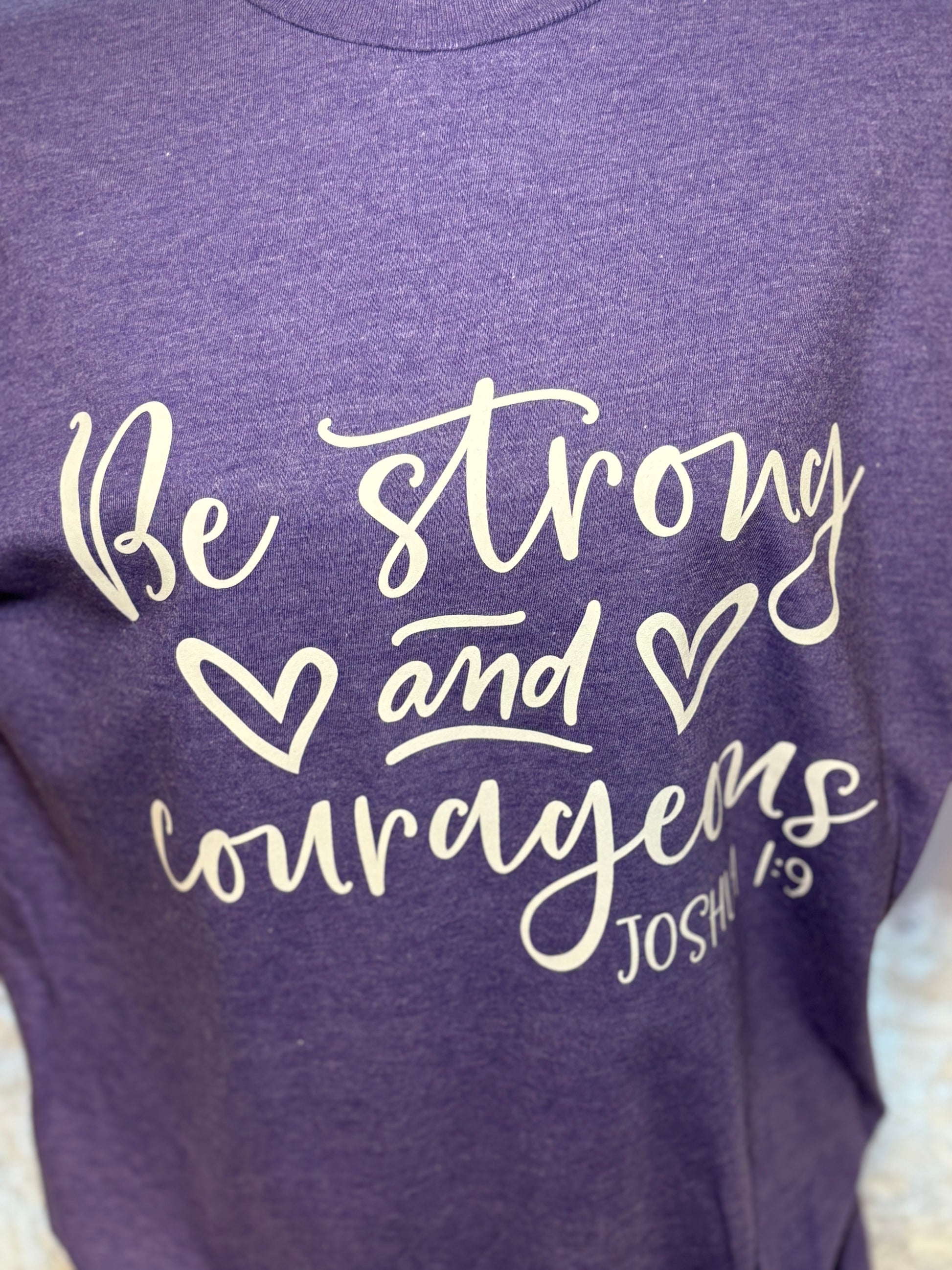 Heather purple heat press t-shirt with 'Be strong and courageous' text