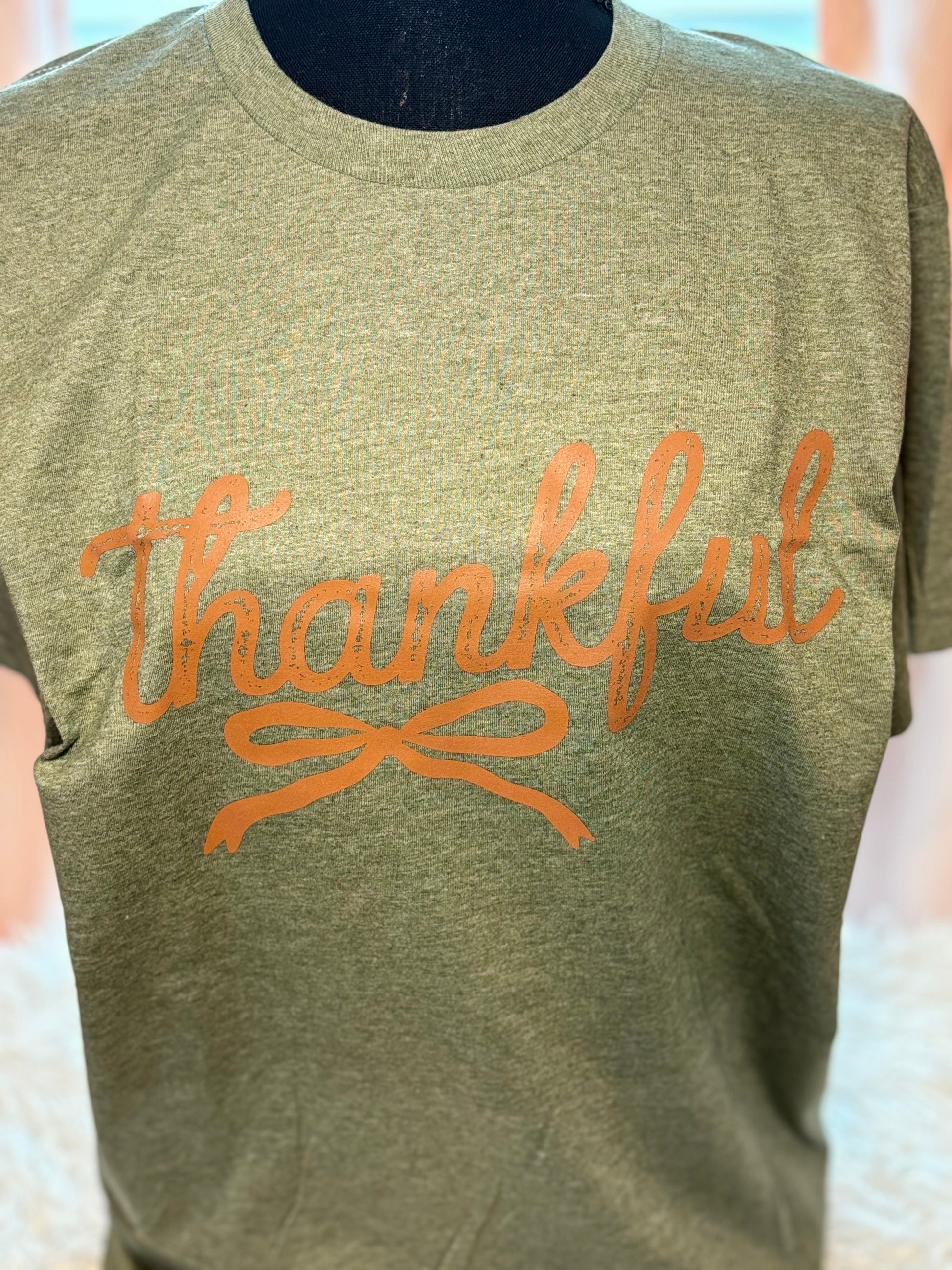 Heather military green heat press t-shirt with 'Thankful' text in brown
