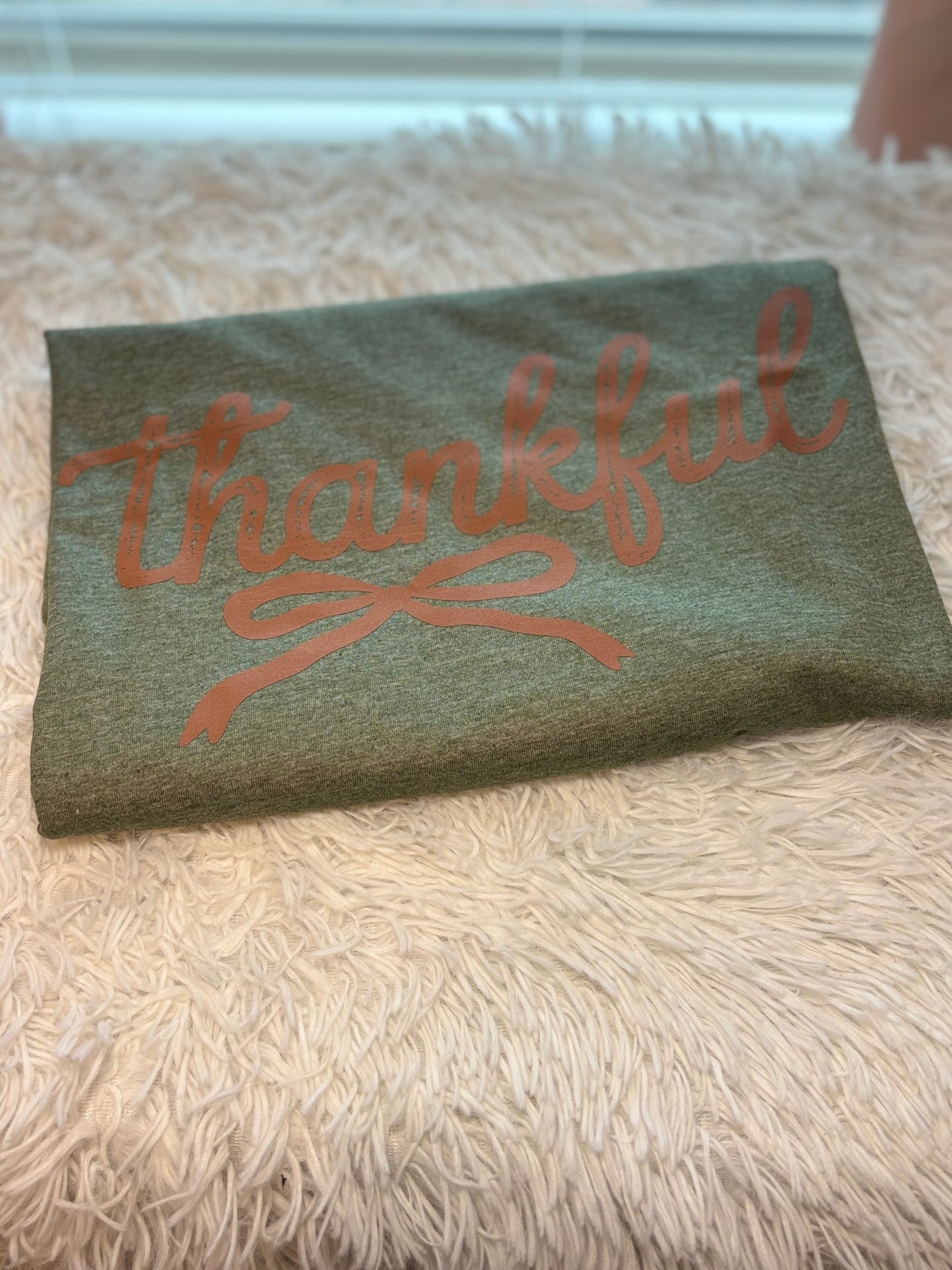 Heather military green heat press t-shirt with 'Thankful' text in brown