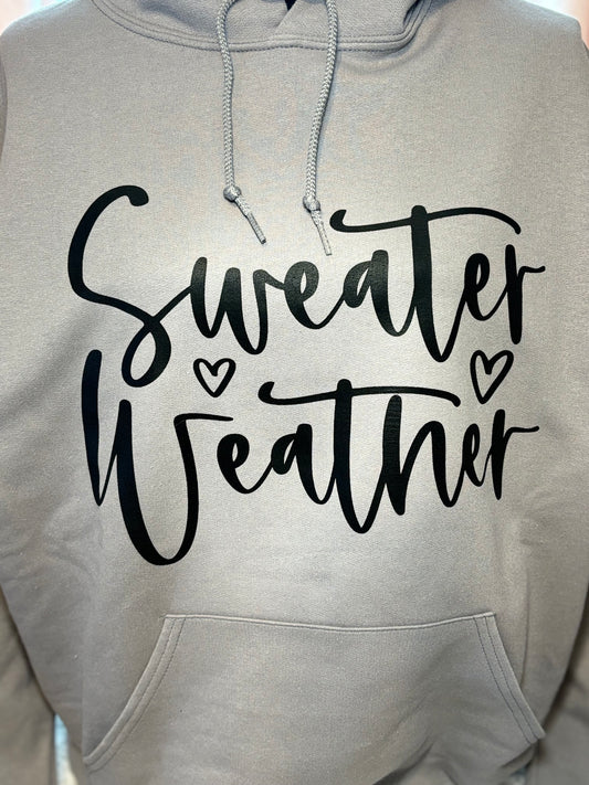Gray heat press hoodie with 'Sweater Weather' text in black