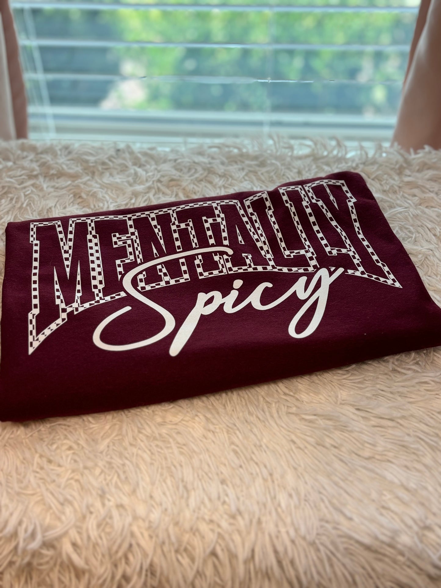 Maroon heat press t-shirt with 'Mentally Spicy' text in white- checkered outline