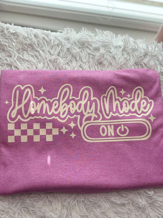 Heather Orchid heat press t-shirt with 'Homebody Mode ON' text in beige