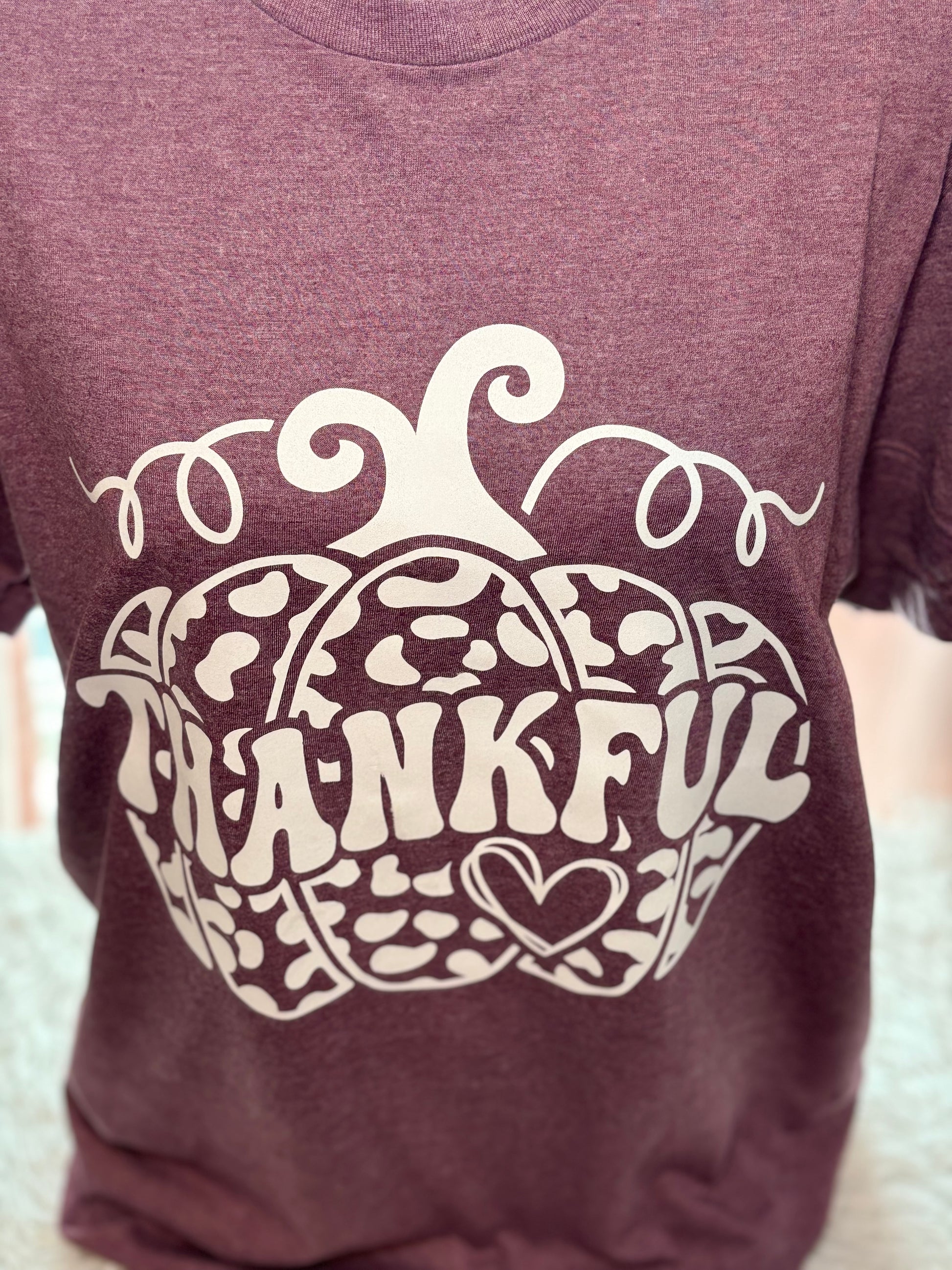 Heather maroon heat press t-shirt with 'THANKFUL' printed in white