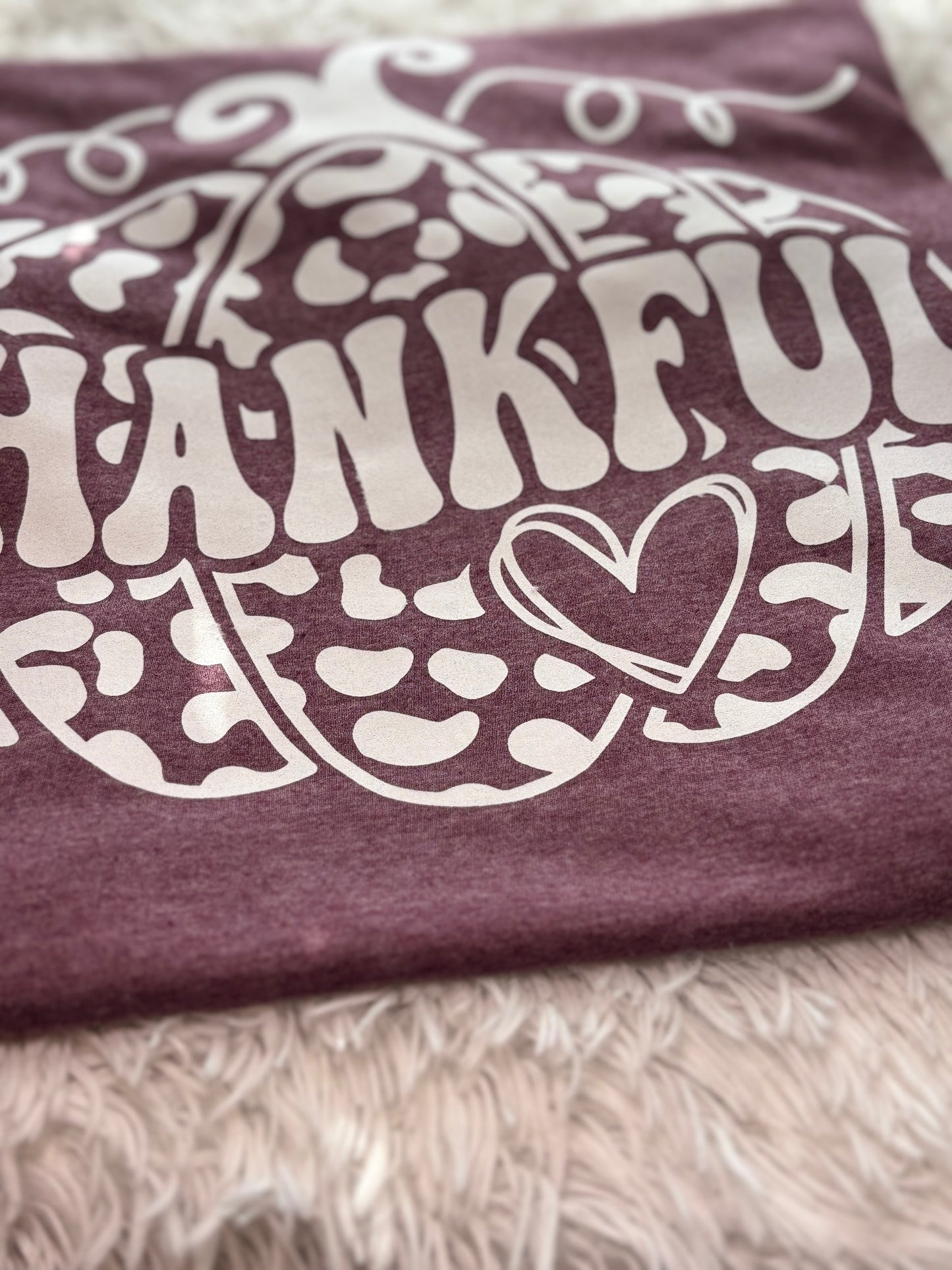 Heather maroon heat press t-shirt with 'THANKFUL' printed in white