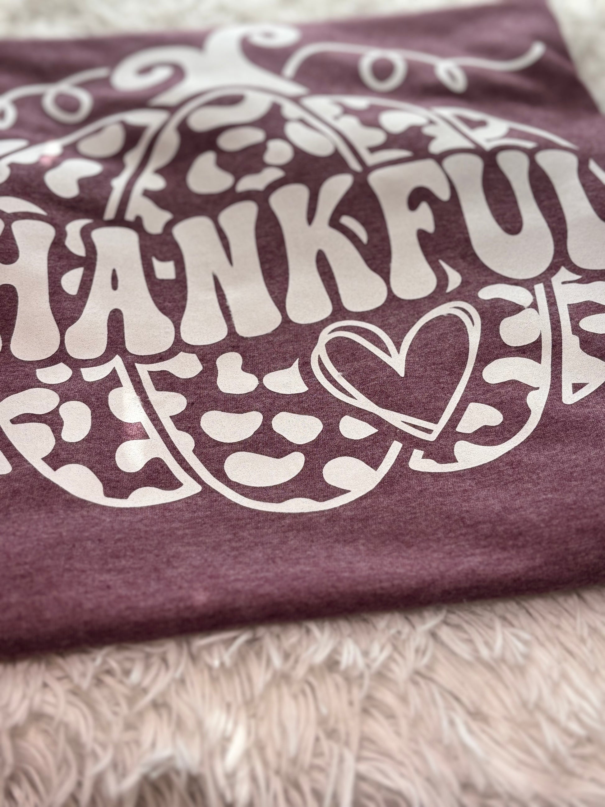 Heather maroon heat press t-shirt with 'THANKFUL' printed in white