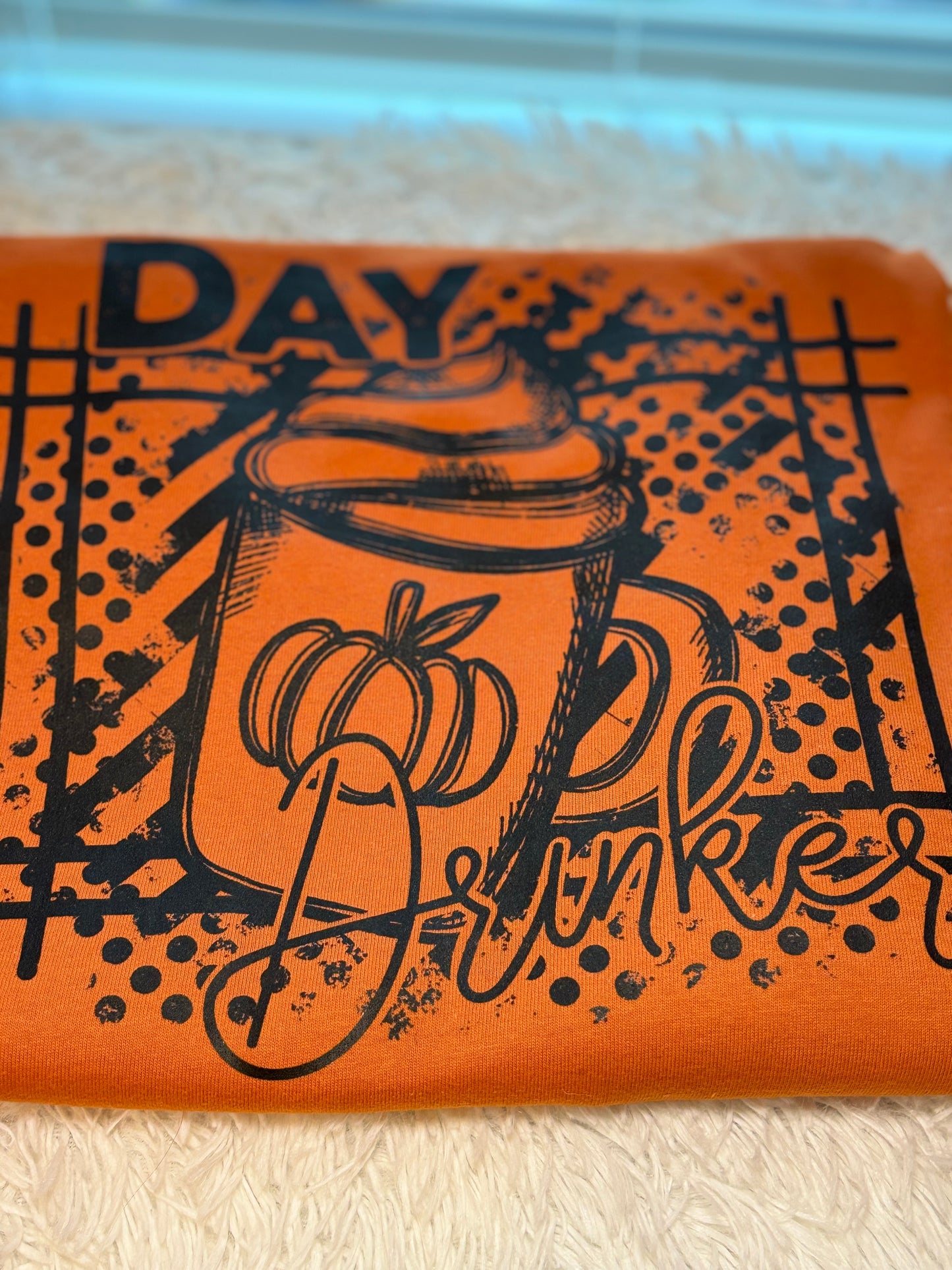 Orange long sleeve t-shirt with black graphic heat press design- Day Drinker latte