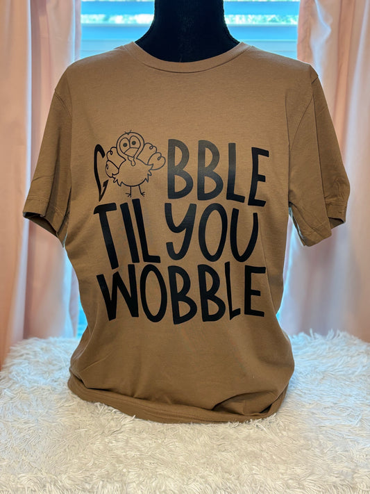 Brown heat press t-shirt with 'Gobble Til You Wobble' text and a turkey graphic