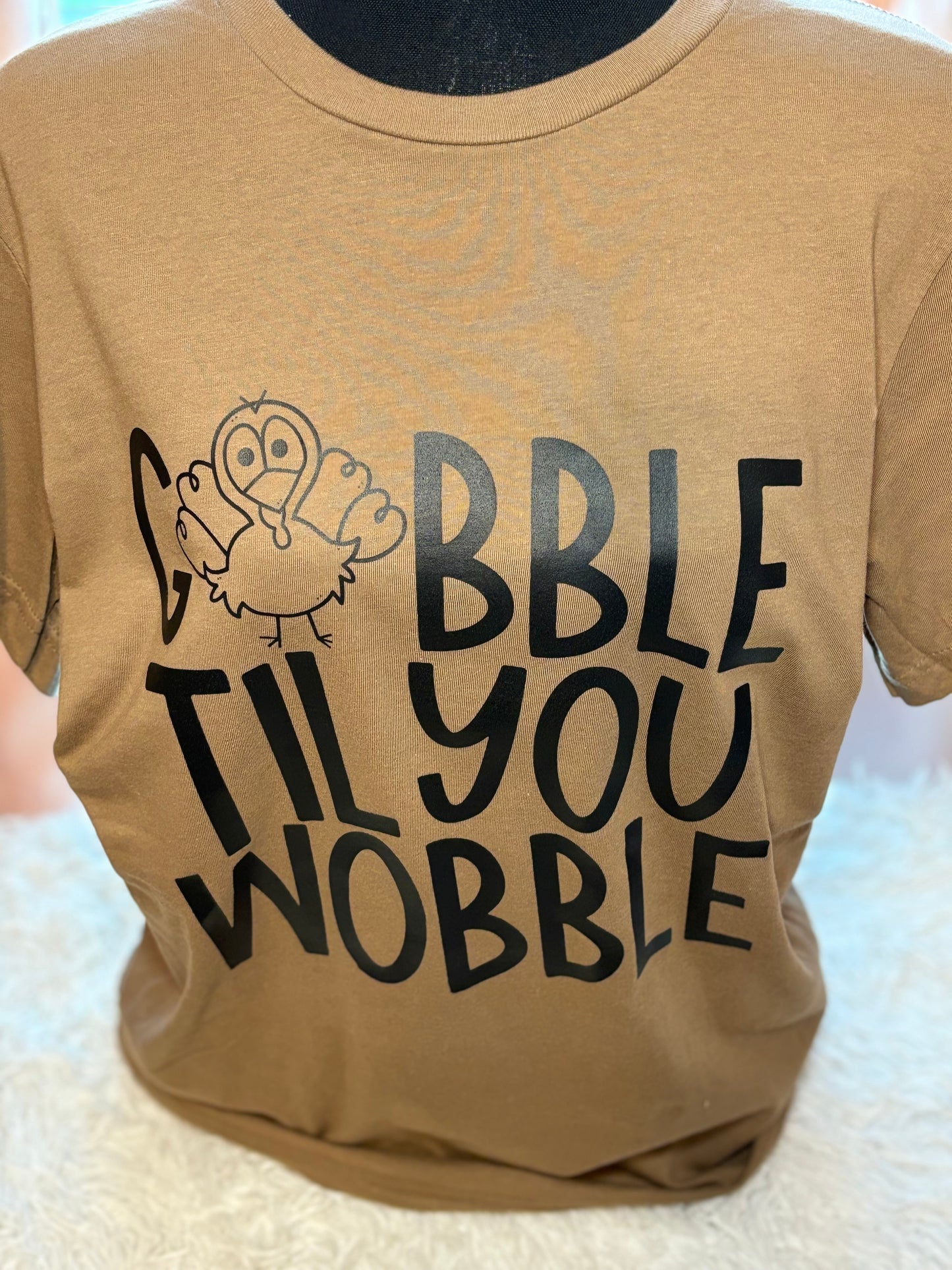Brown heat press t-shirt with 'Gobble Til You Wobble' text and a turkey graphic