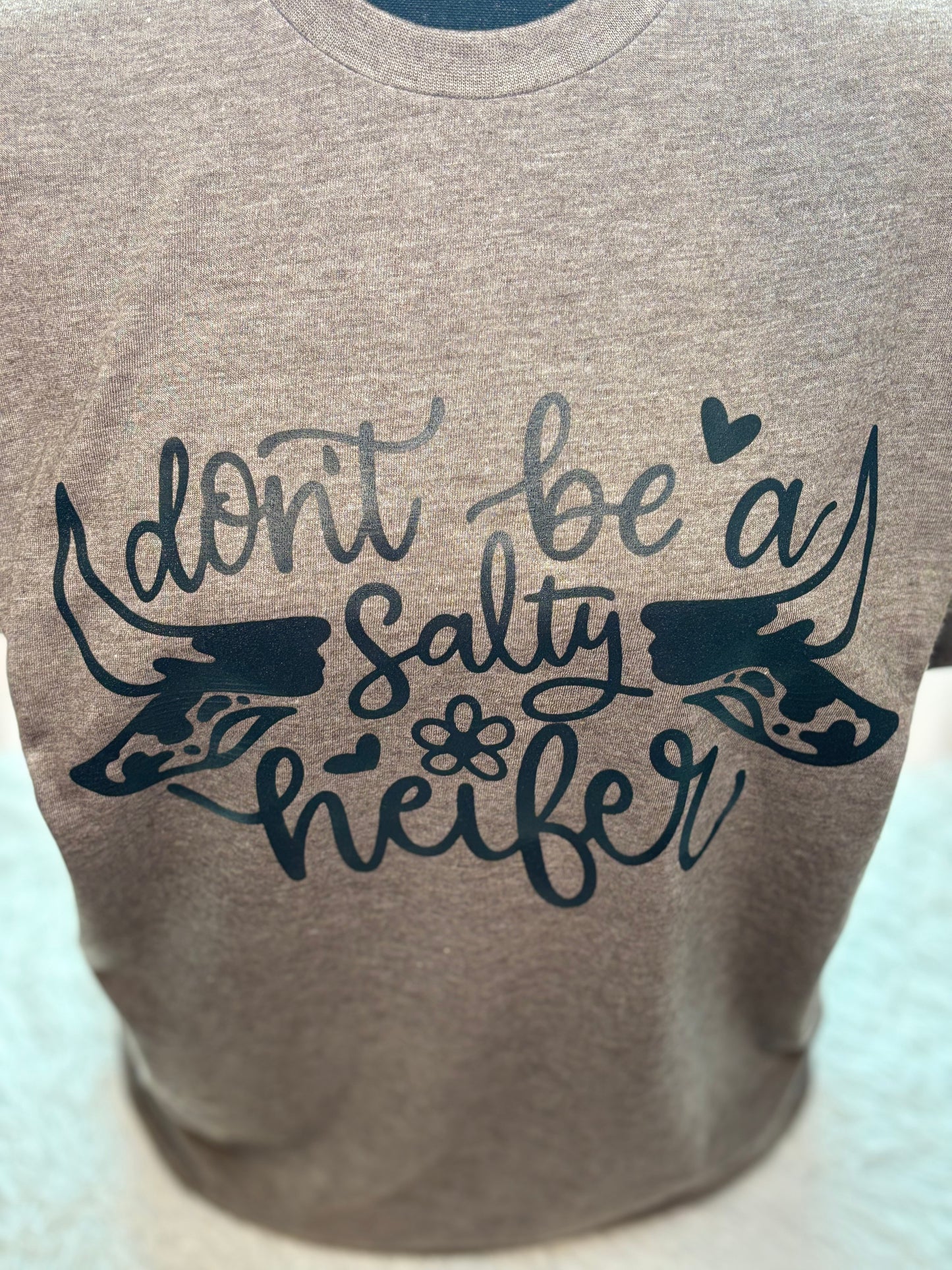 Heather brown heat press t-shirt with 'Don't be a Salty Heifer' text in black