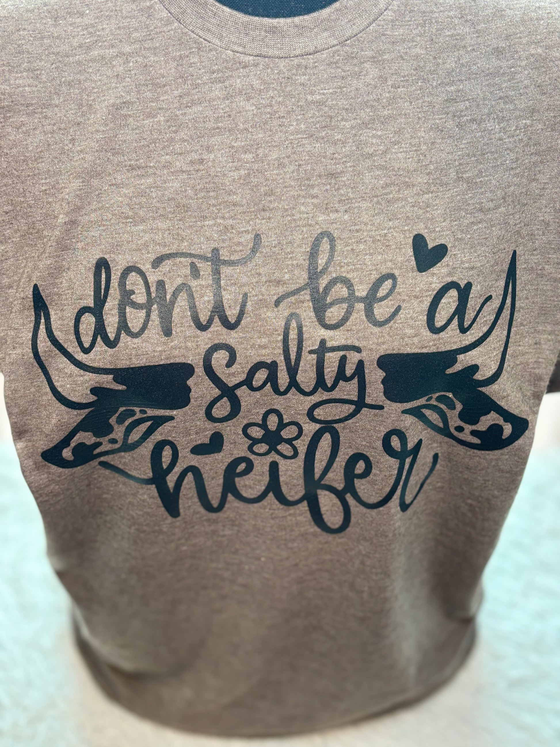 Heather brown heat press t-shirt with 'Don't be a Salty Heifer' text in black