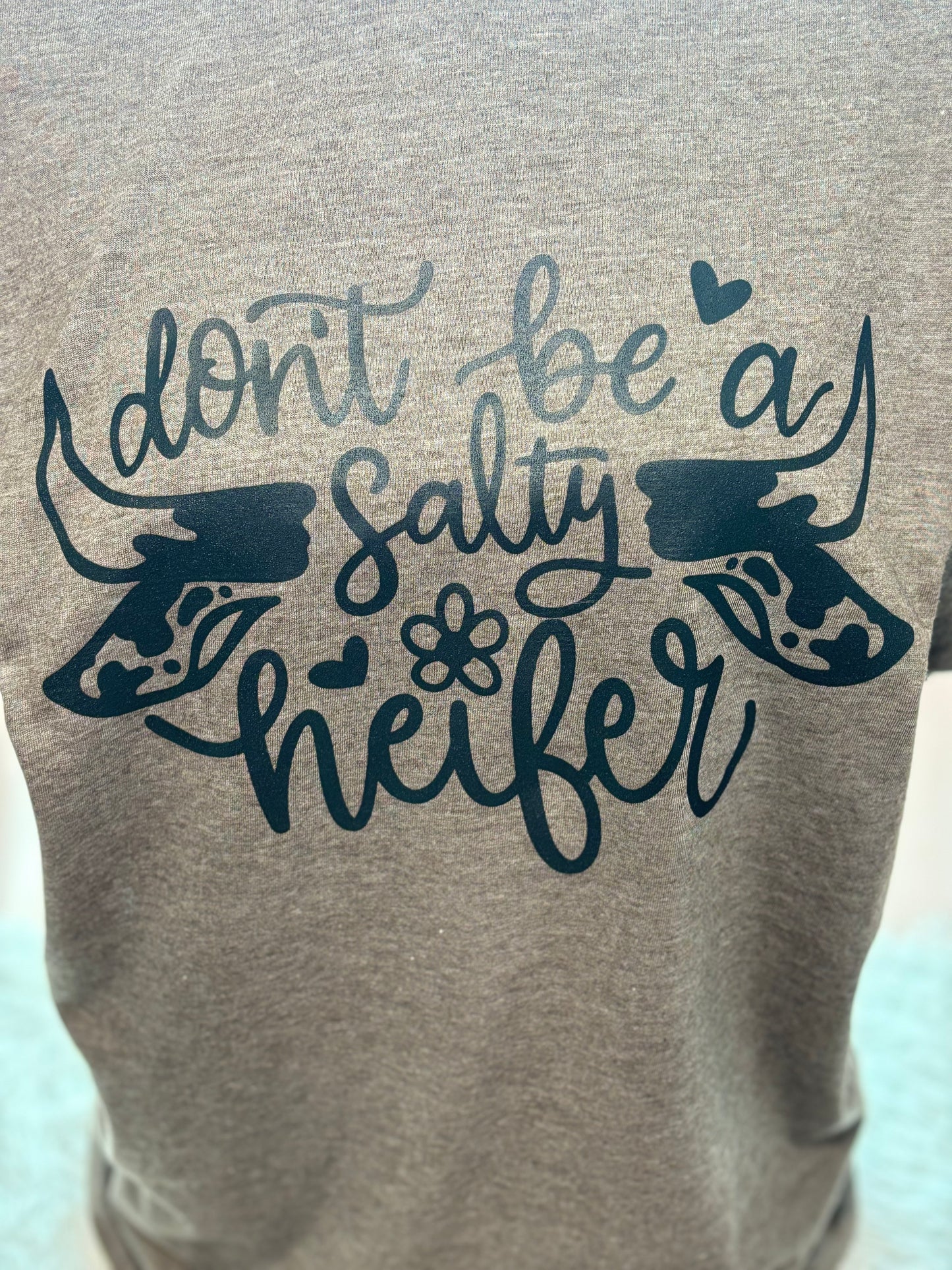 Heather brown heat press t-shirt with 'Don't be a Salty Heifer' text in black