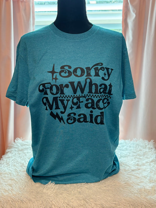 Blue heat press t-shirt with text 'Sorry For What My Face Said' in black