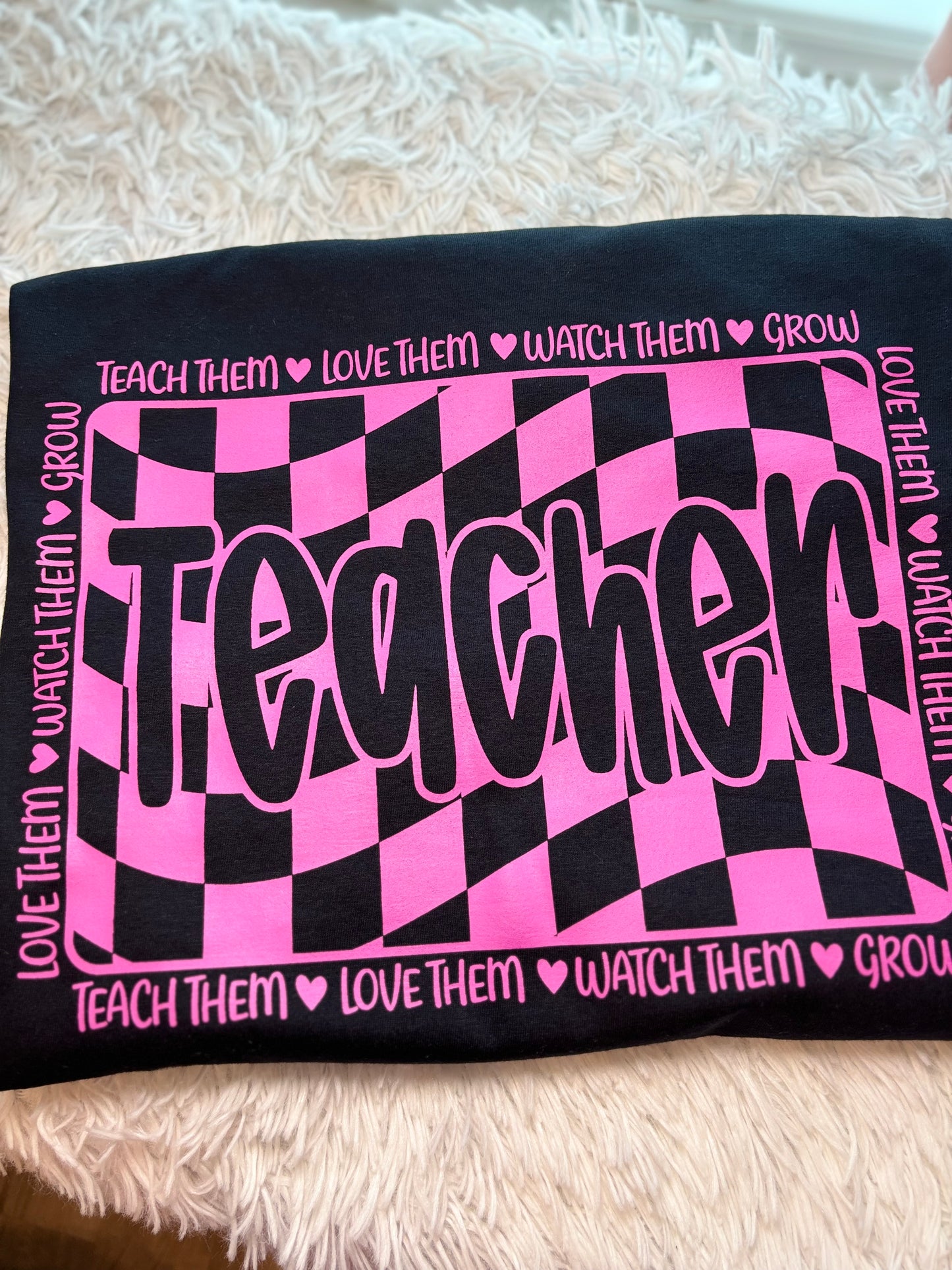 Pink and black checkered heat press t-shirt with 'Teacher' text