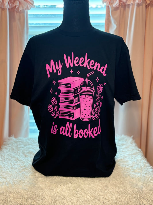 Black heat press t-shirt with neon pink text and graphics - My Weekend is all booked with books. coffee, and flowers