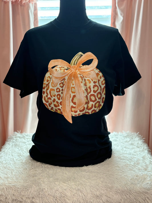 Black t-shirt with a heat press glitter leopard print pumpkin design