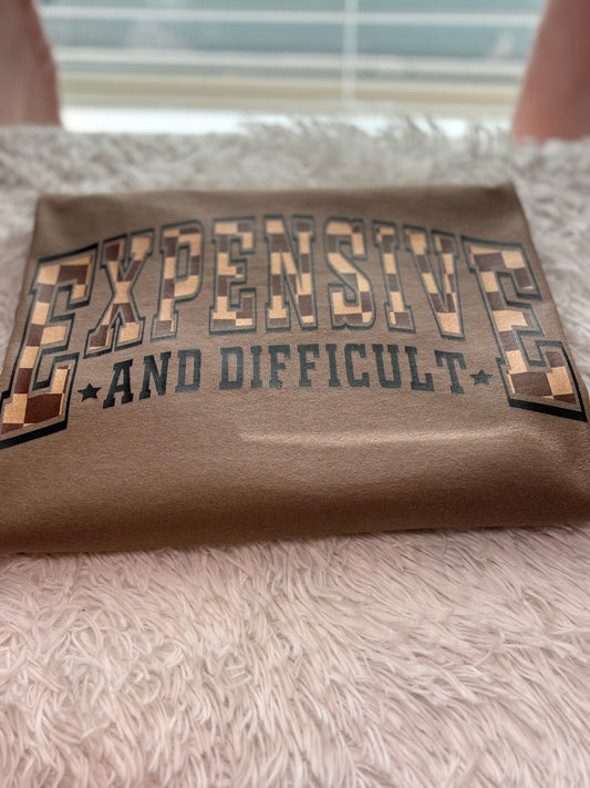 Brown heat press t-shirt with text 'EXPENSIVE AND DIFFICULT' - checkered