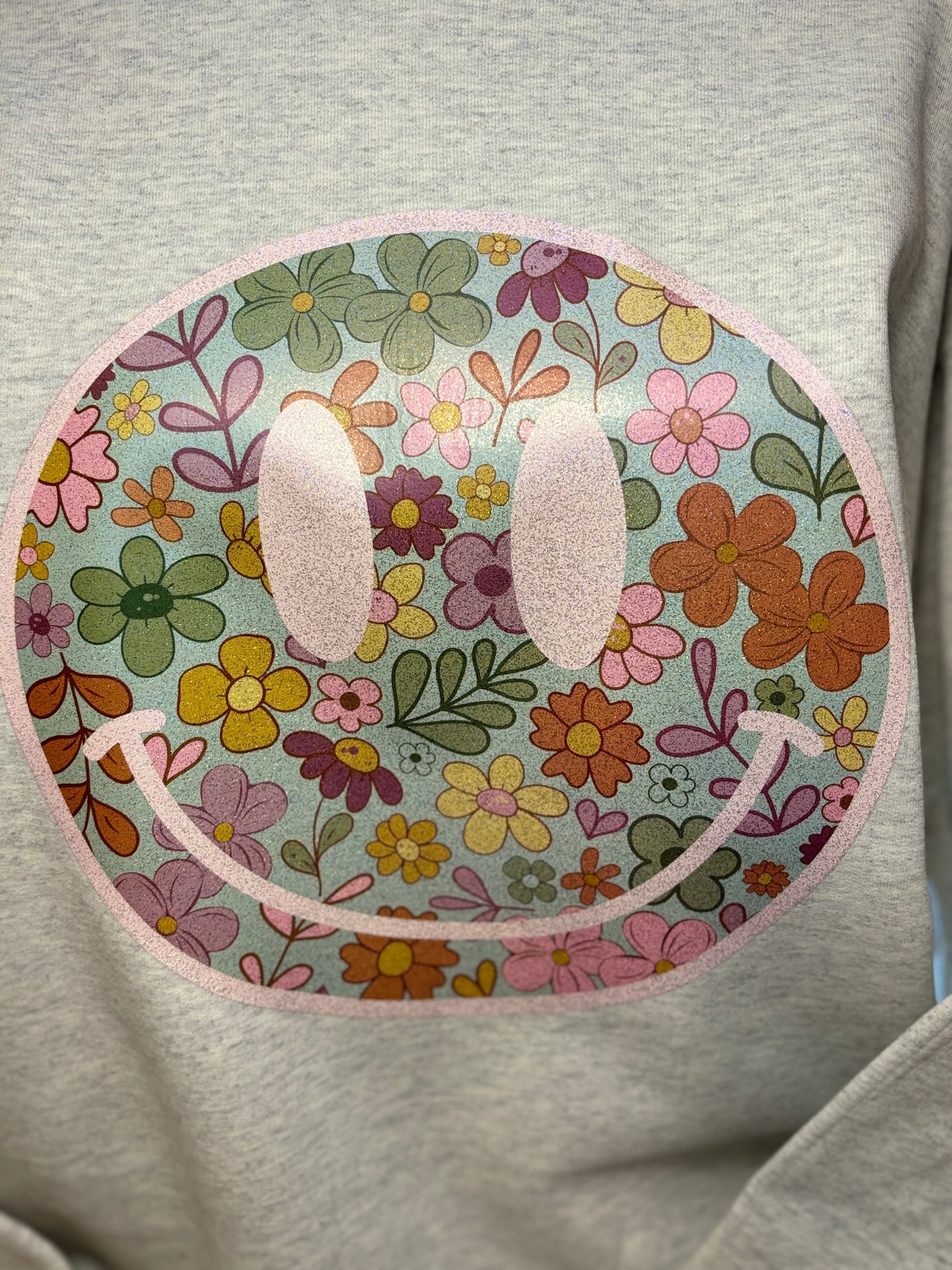 Heat press boho floral patterned face on an oatmeal heather sweatshirt