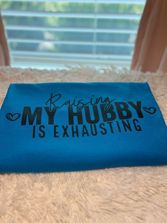 Turquoise heat press t-shirt with text 'Raising MY HUBBY IS EXHAUSTING' in black