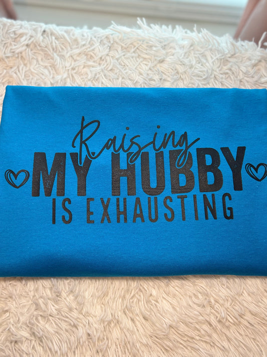 Turquoise heat press t-shirt with text 'Raising MY HUBBY IS EXHAUSTING' in black