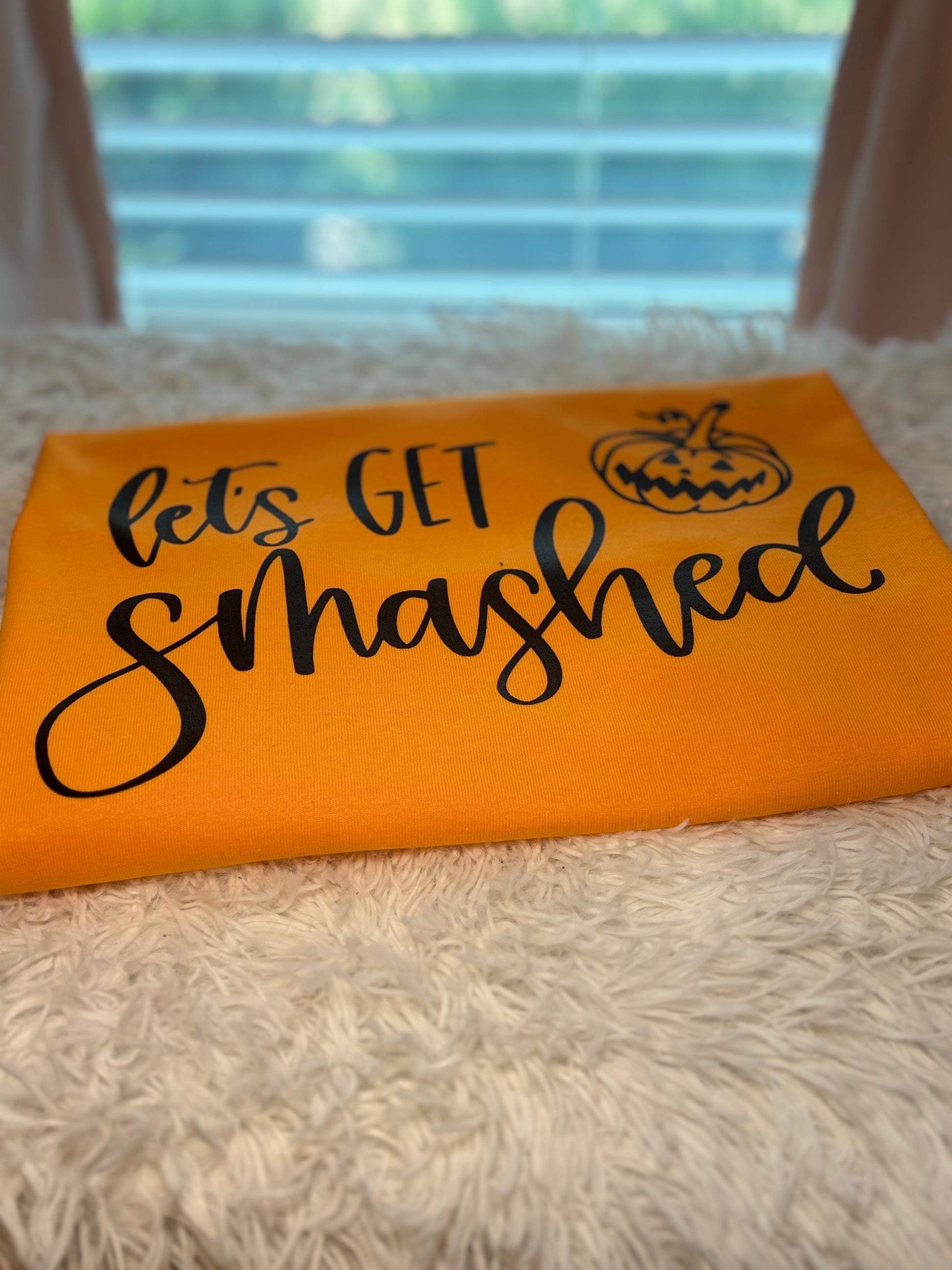 Orange t-shirt with 'let's GET smashed' text and pumpkin heat press graphic