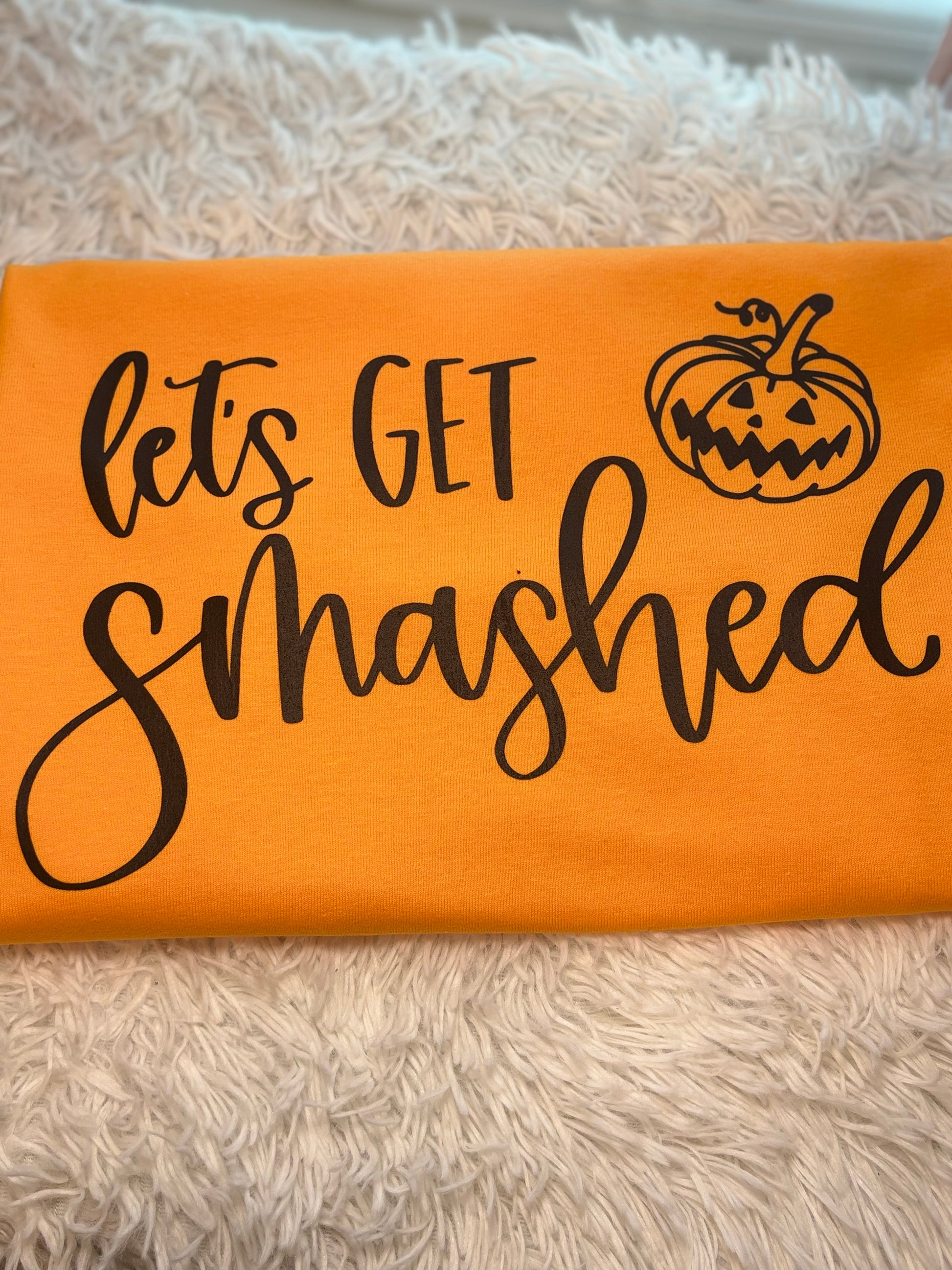 Orange t-shirt with 'let's GET smashed' text and pumpkin heat press graphic