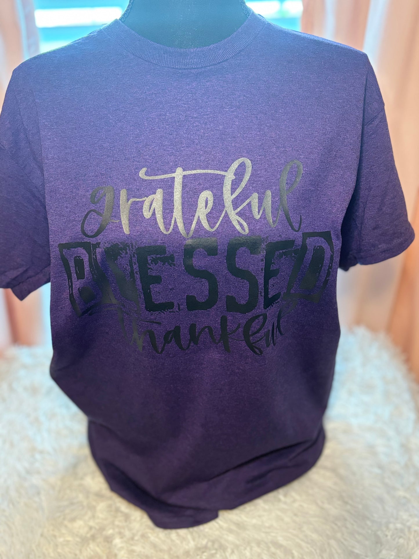 Purple heat press t-shirt with 'grateful blessed thankful' text in black