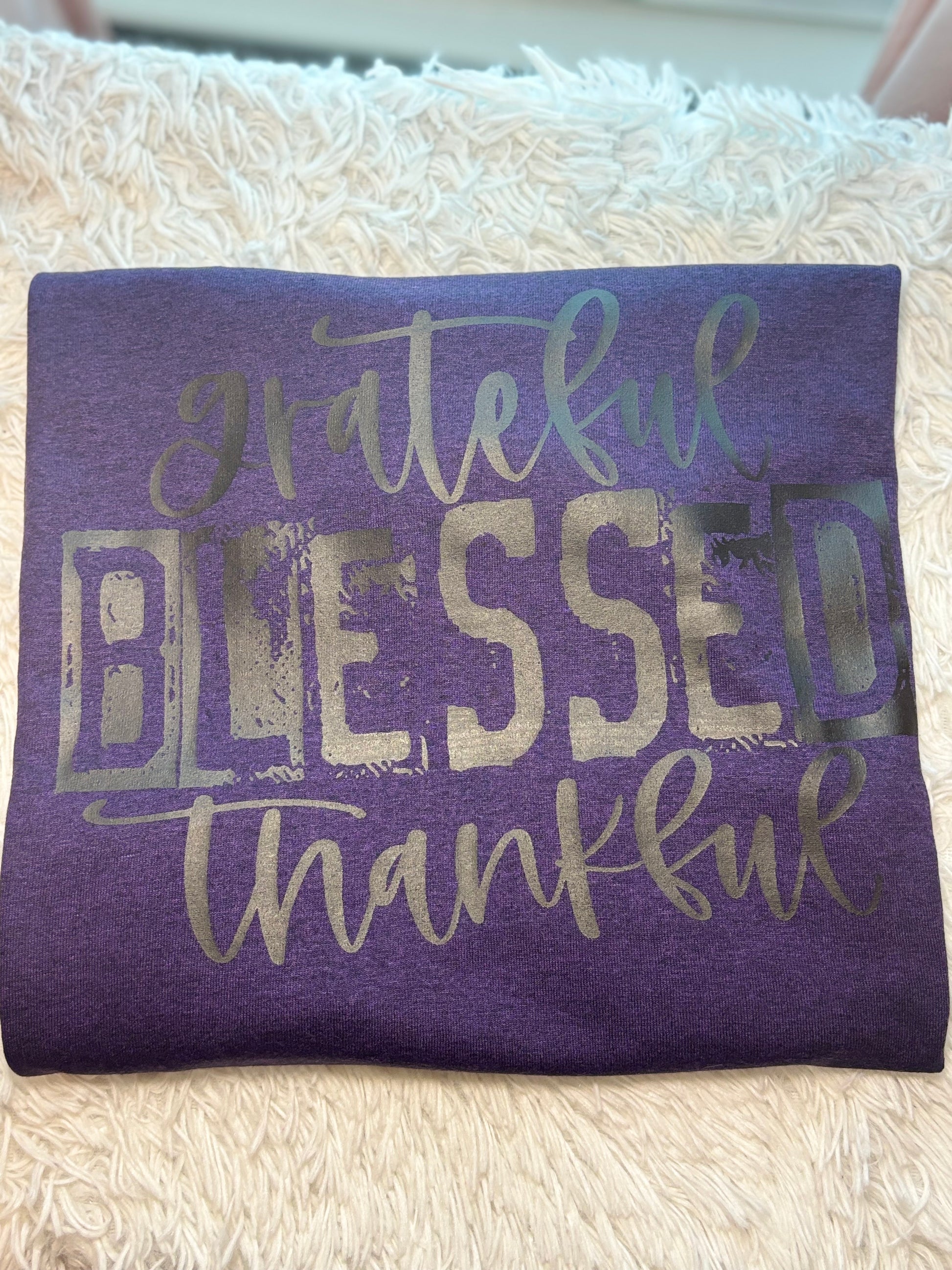Purple heat press t-shirt with 'grateful blessed thankful' text in black