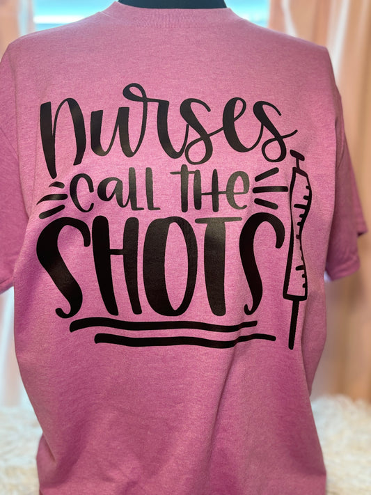 Pink heat press t-shirt with 'Nurses call the shots' text and a syringe black graphic