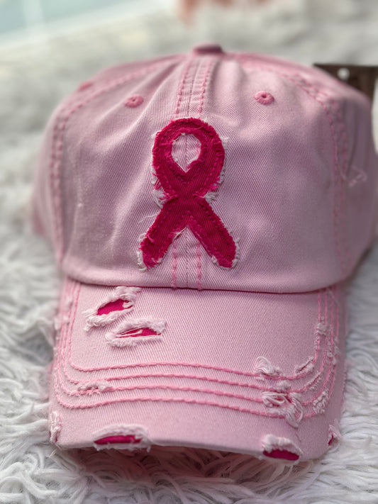 Pink baseball cap with a breast cancer awareness ribbon