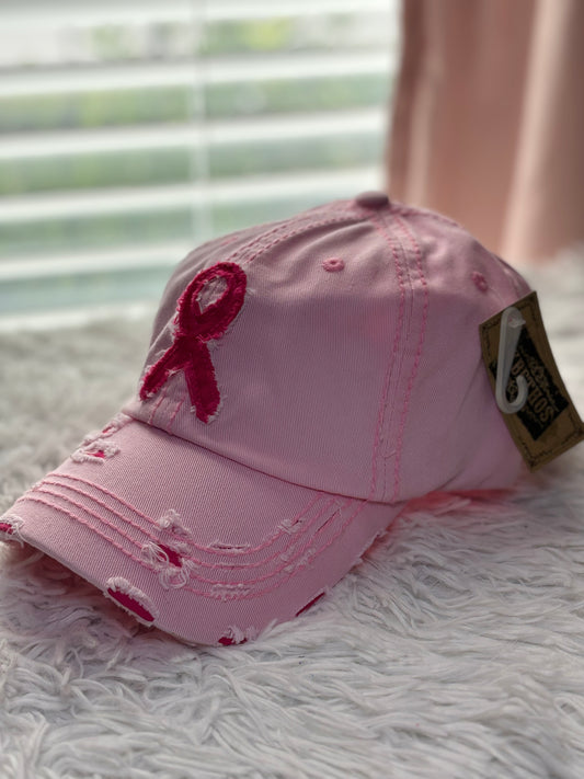 Pink baseball cap with a breast cancer awareness ribbon