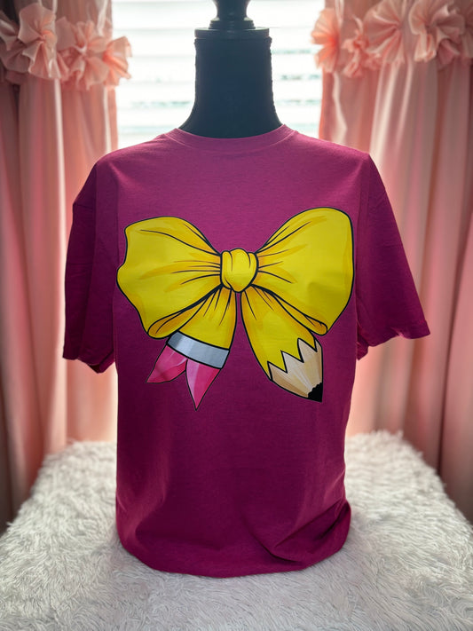 Pink heat press t-shirt with a large yellow pencil bow design