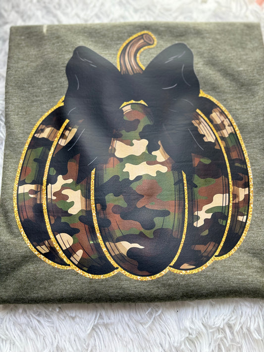 Military green t-shirt with a heat press camouflage pumpkin with bow and outlined in gold