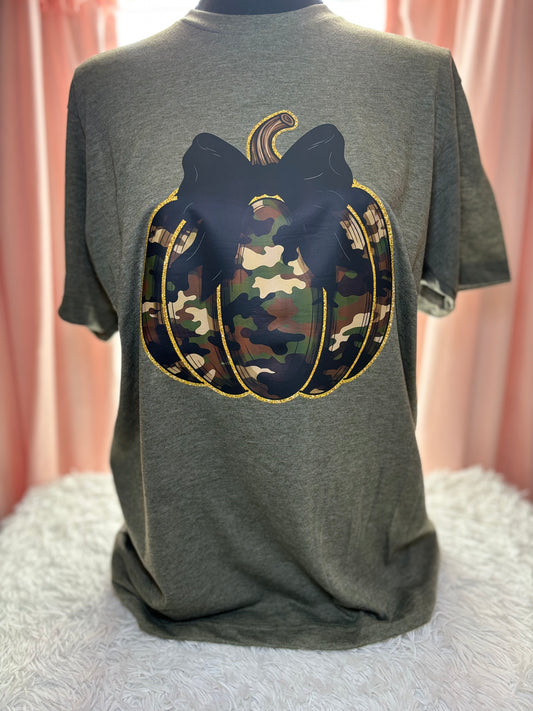 Military green t-shirt with a heat press camouflage pumpkin with bow and outlined in gold