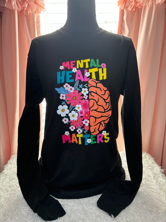 Black long sleeve heat press t-shirt with a colorful brain and flowers design and 'Mental Health Matters' text.