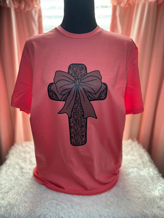 Coral heat press t-shirt with a black lace cross and bow design