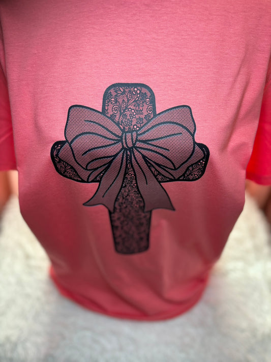 Coral heat press t-shirt with a black lace cross and bow design