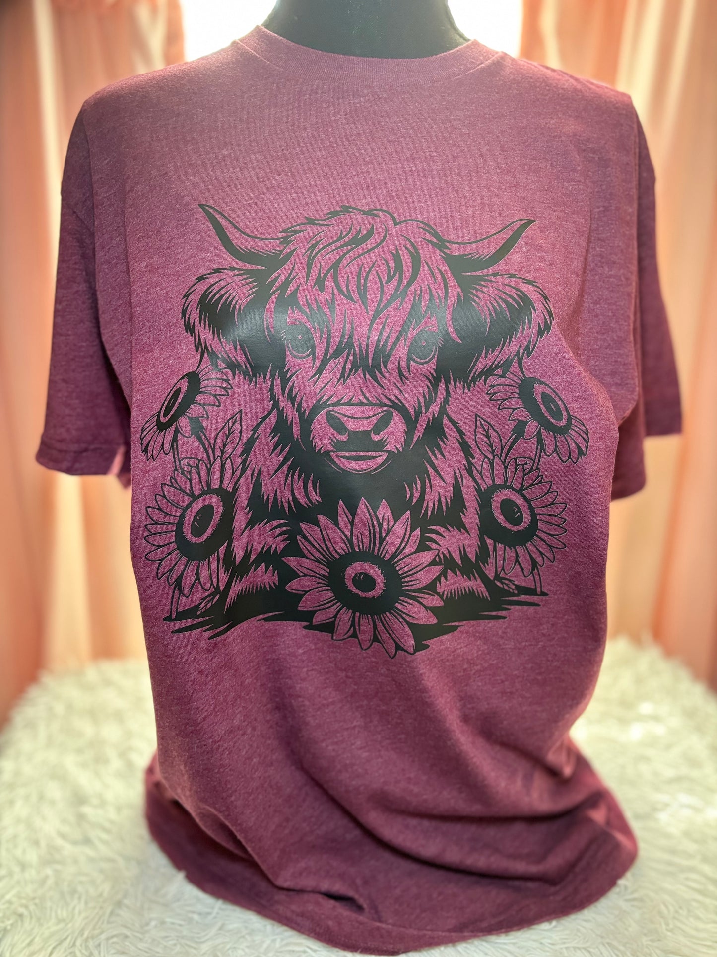 Heather maroon heat press t-shirt with black highland cow and sunflower design