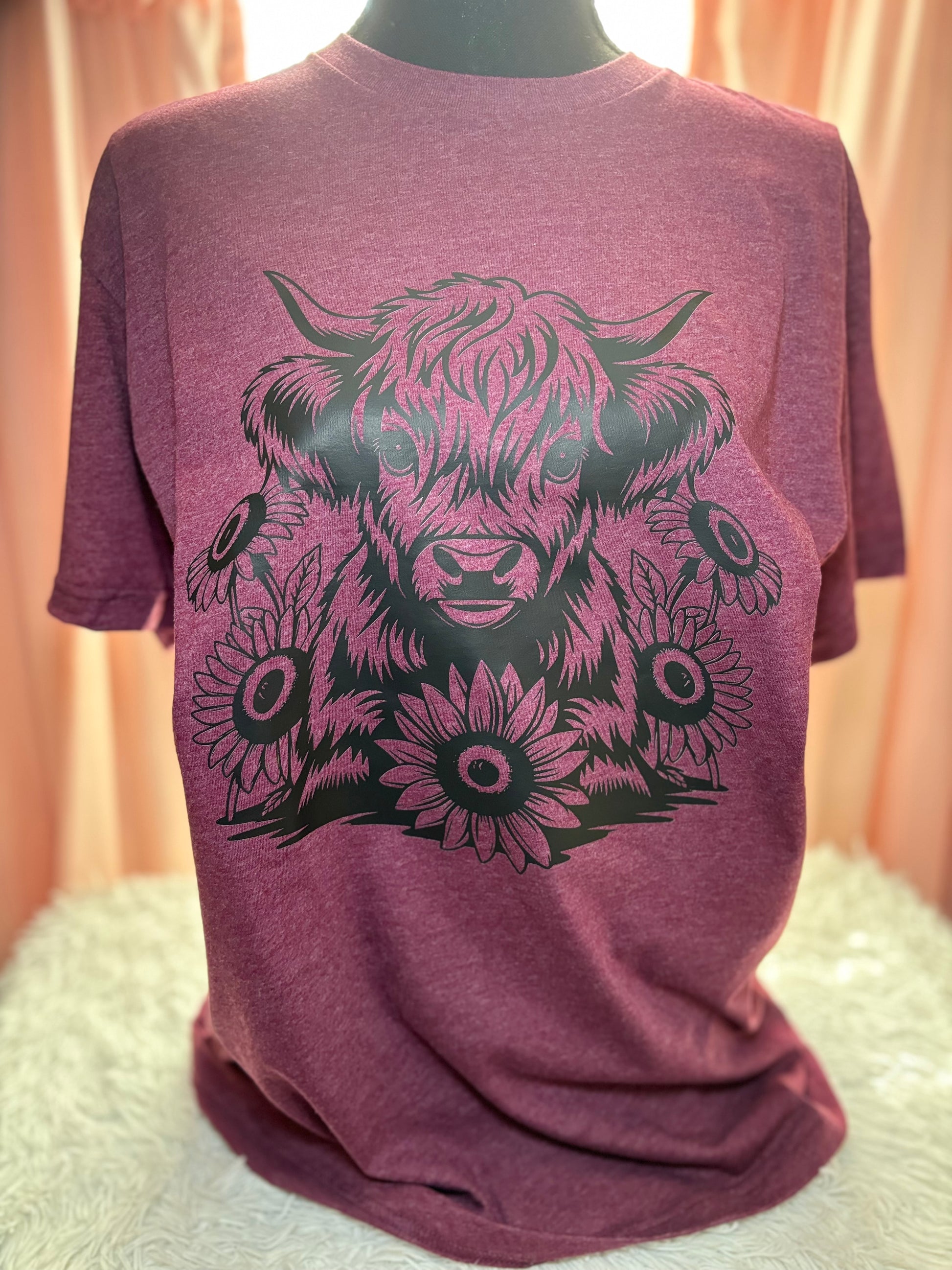Heather maroon heat press t-shirt with black highland cow and sunflower design