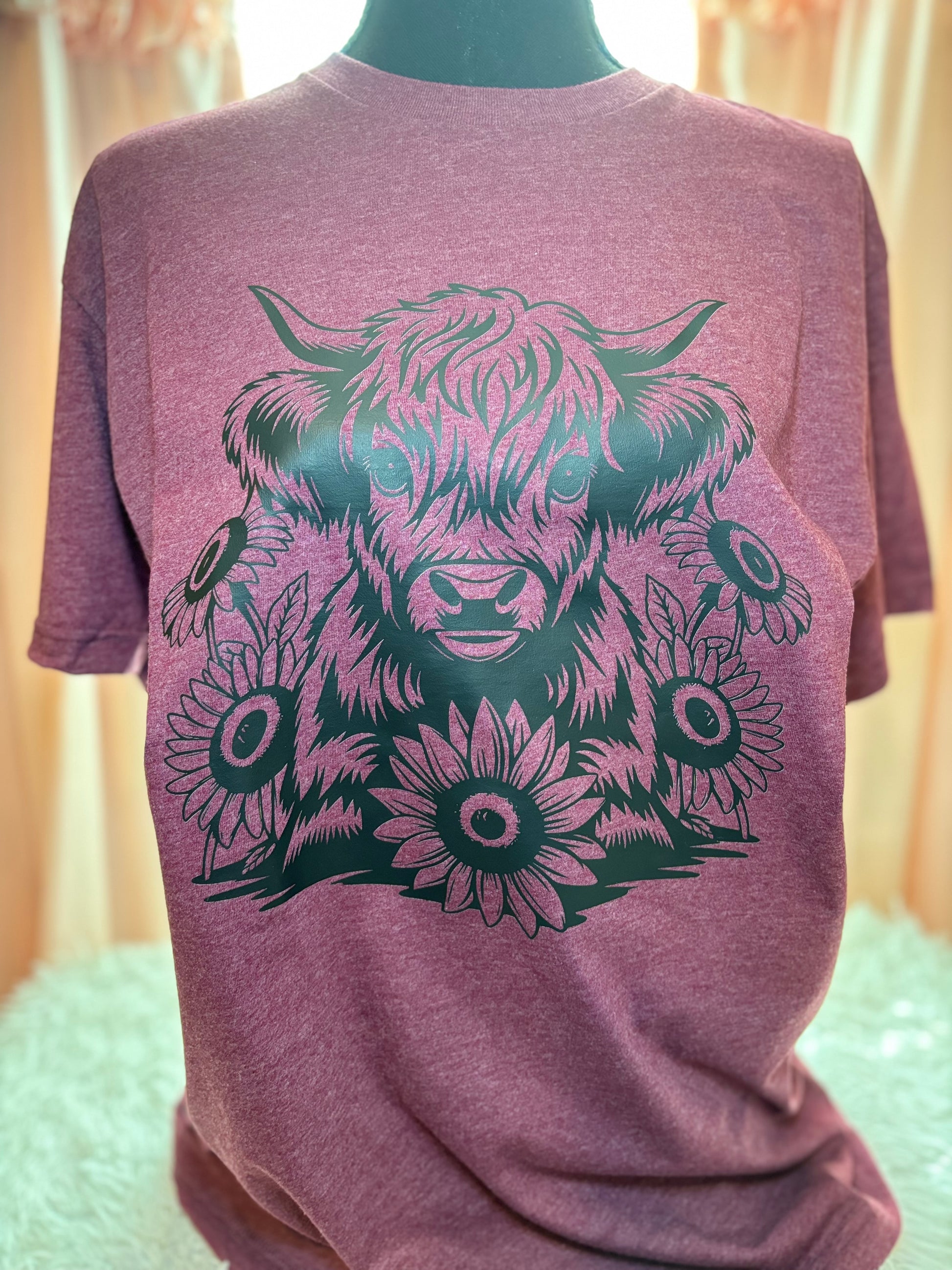 Heather maroon heat press t-shirt with black highland cow and sunflower design