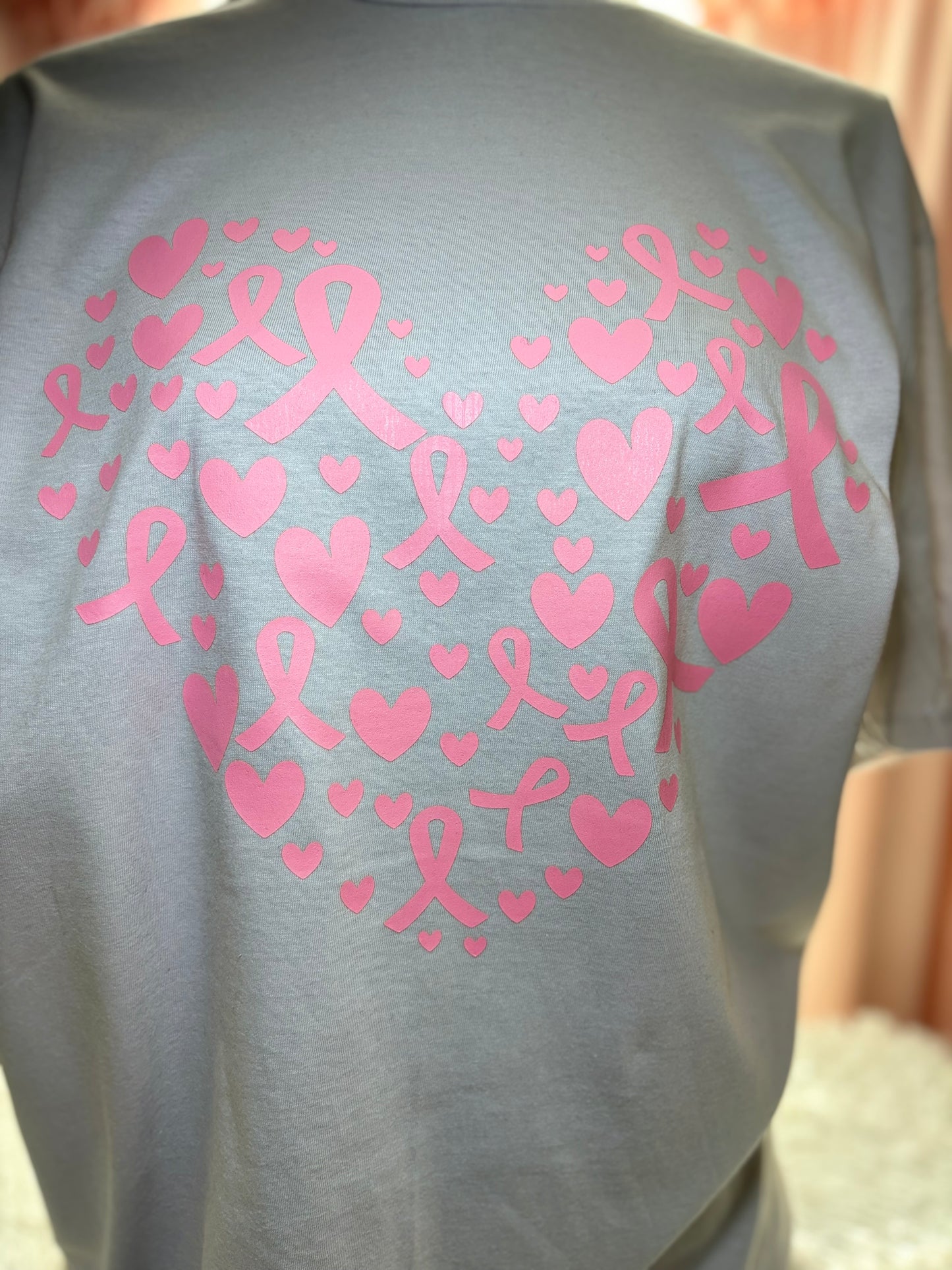 Light gray heat press t-shirt with pink hearts and breast cancer awareness ribbons