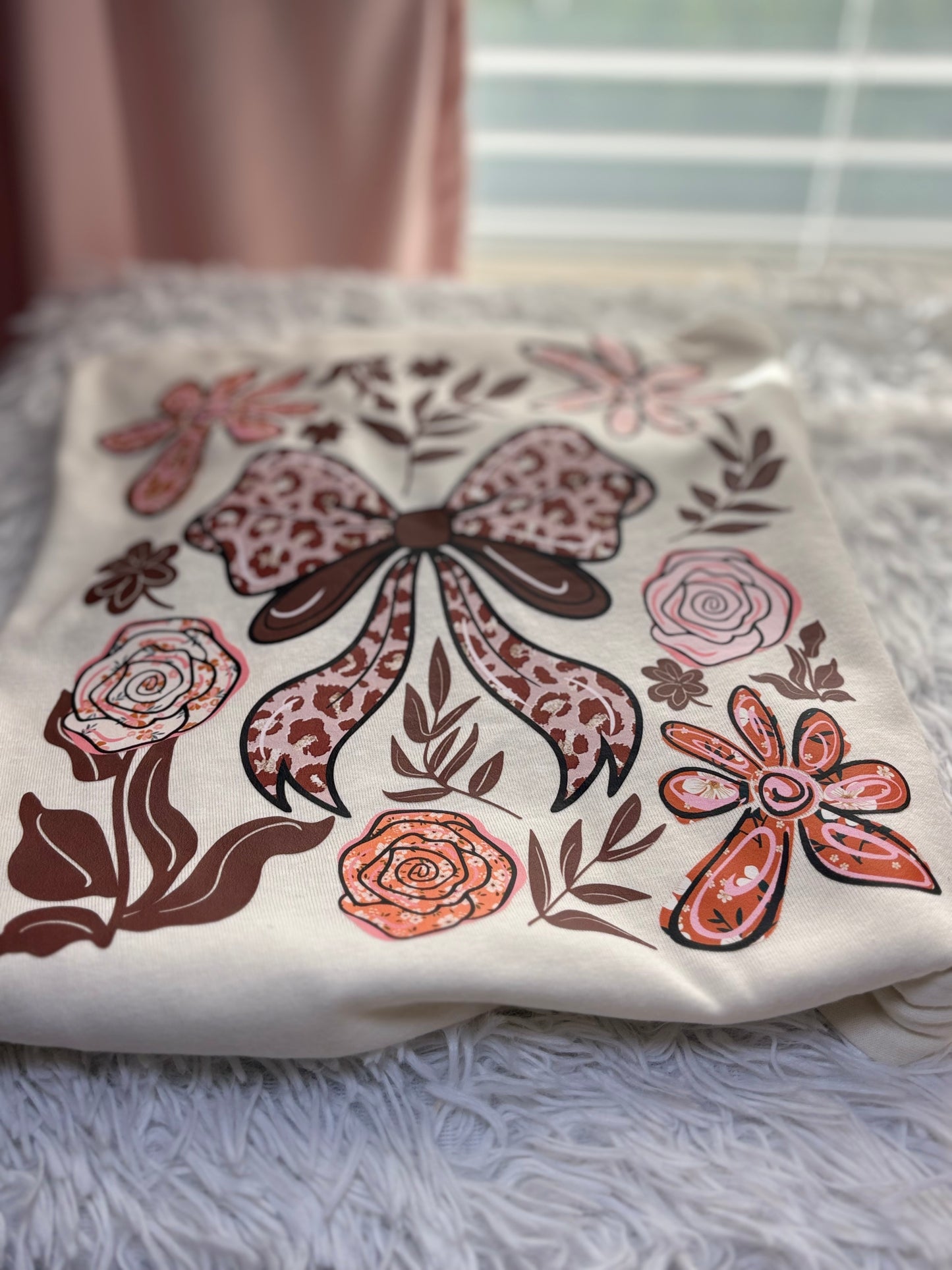 Beige t-shirt with a decorative heat press bow and floral patterns