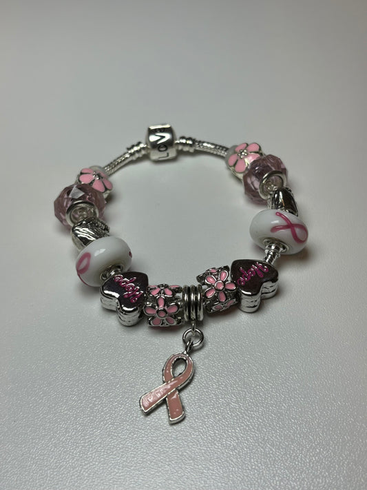 Silver bracelet with pink ribbon and flower charms