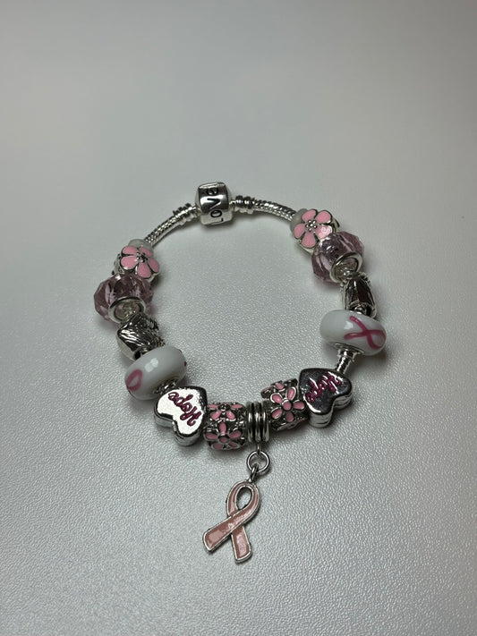 Silver bracelet with pink ribbon and flower charms