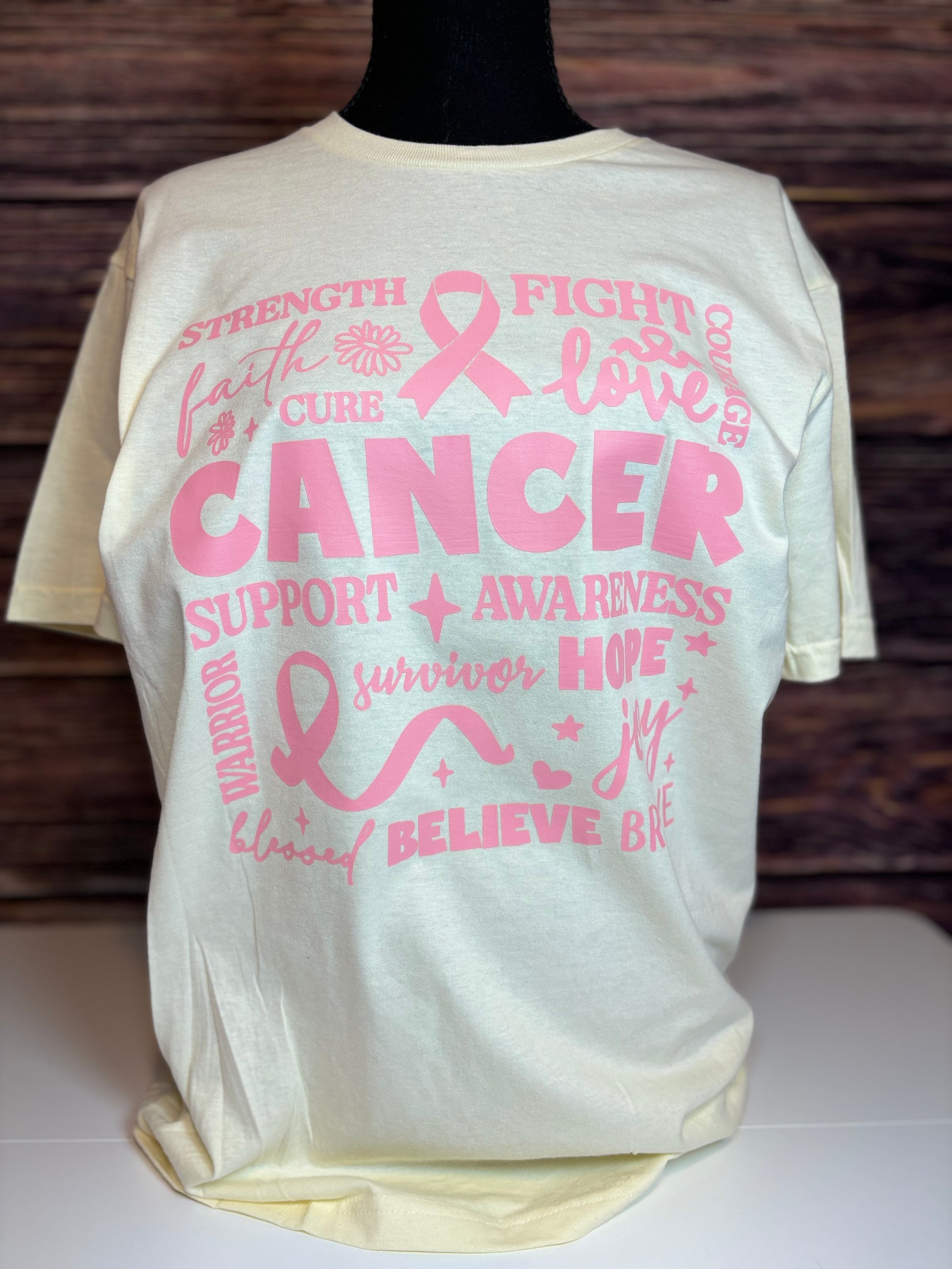 Off white heat pressed t-shirt with pink cancer awareness text and symbols