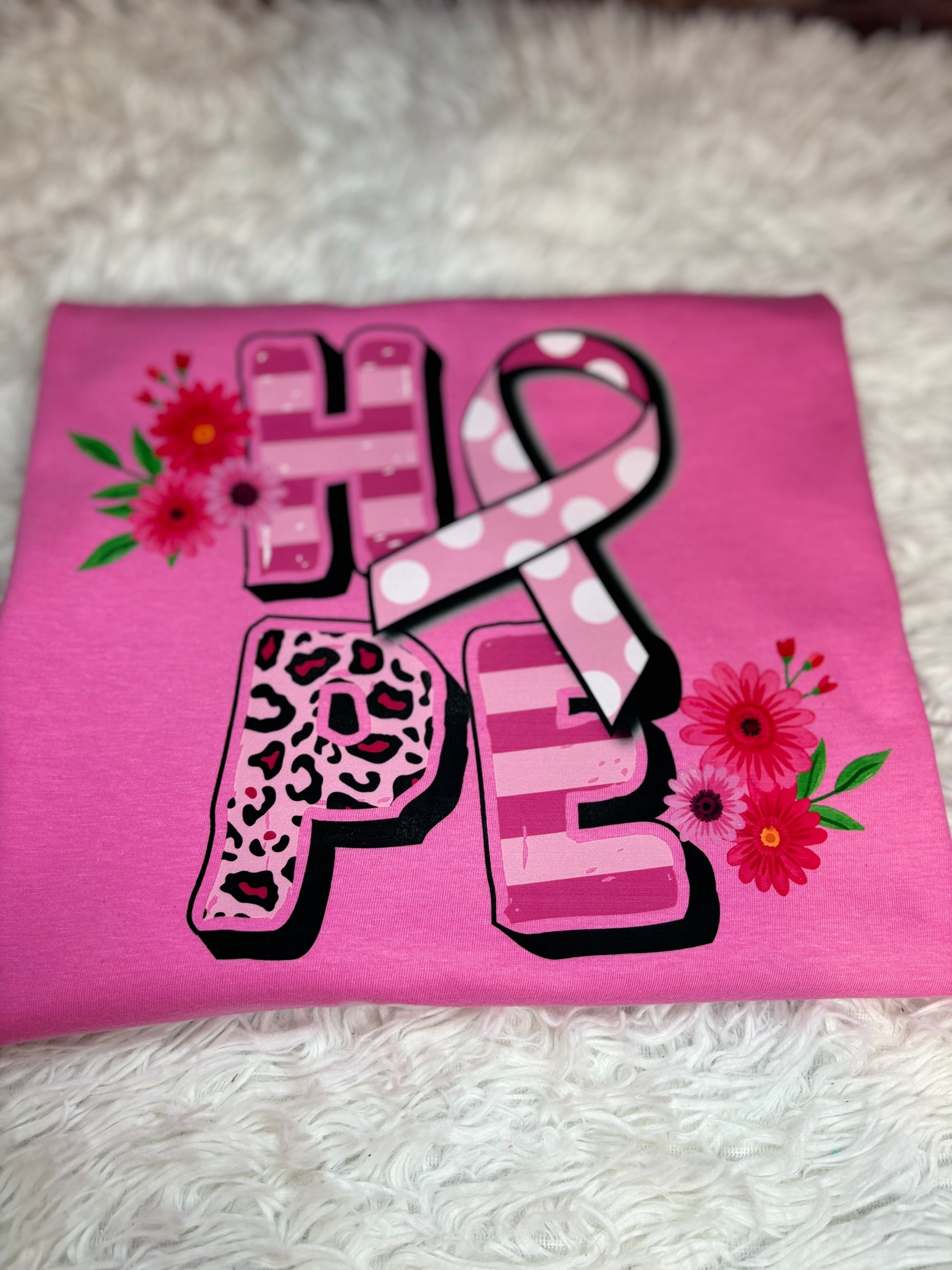 Pink heat pressed t-shirt with 'HOPE' design featuring a ribbon and flowers - Breast Cancer Awareness