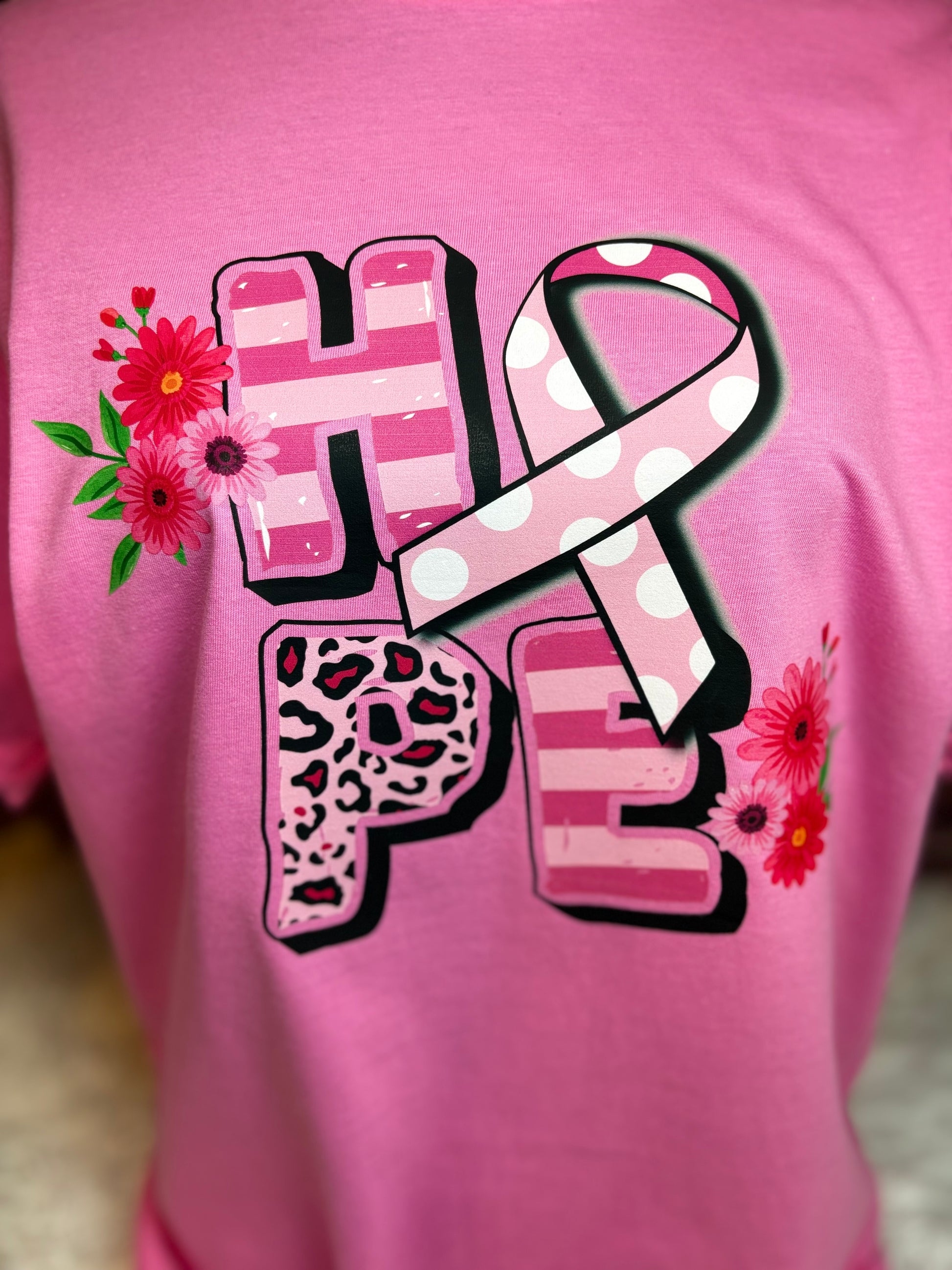 Pink heat pressed t-shirt with 'HOPE' design featuring a ribbon and flowers - Breast Cancer Awareness