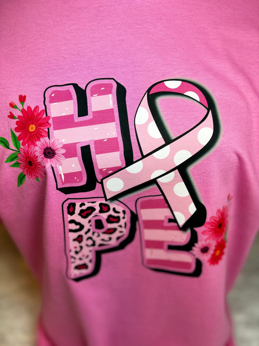 Pink heat pressed t-shirt with 'HOPE' design featuring a ribbon and flowers - Breast Cancer Awareness