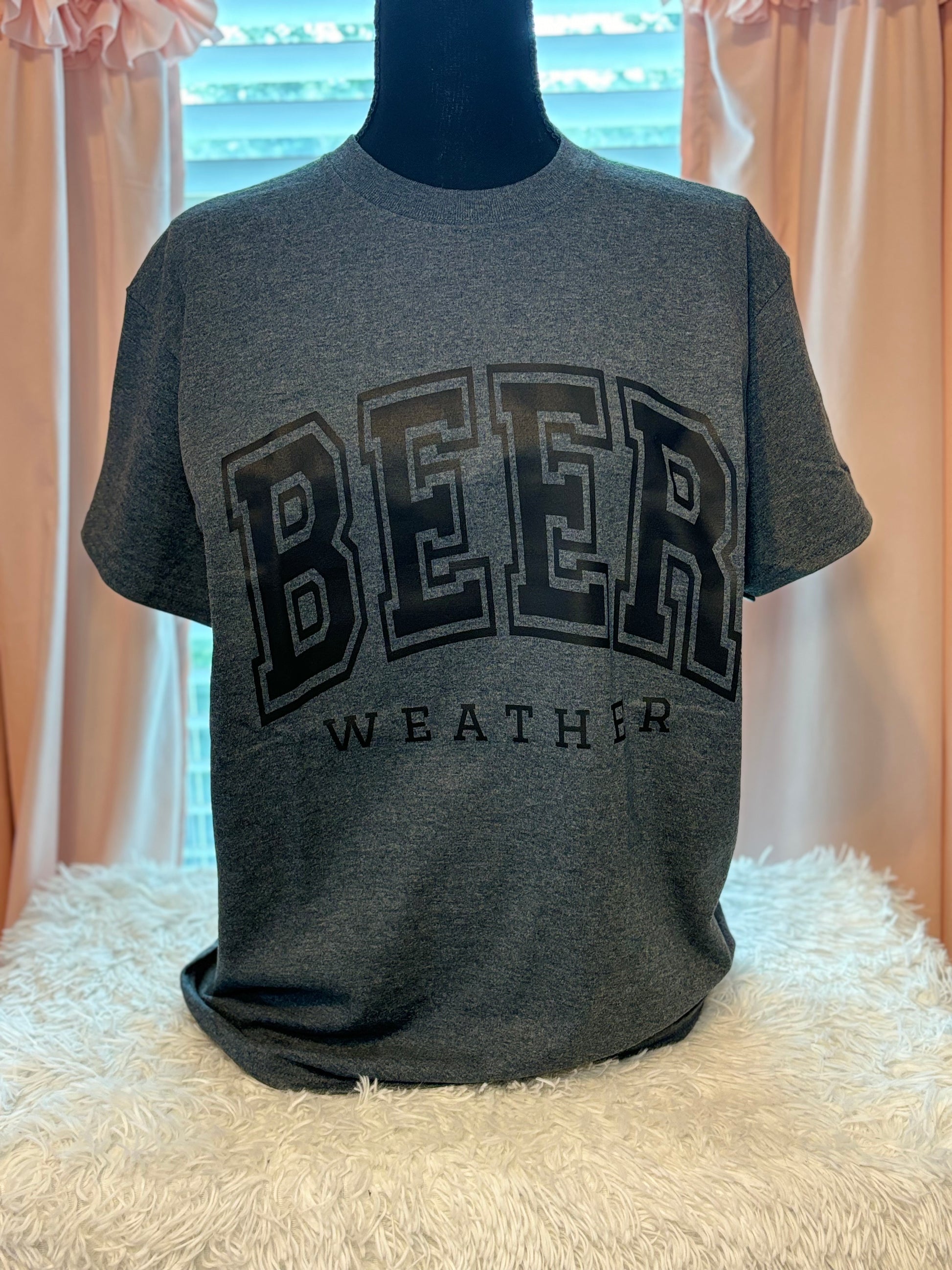 Dark heather heat press t-shirt with 'BEER WEATHER' text in black